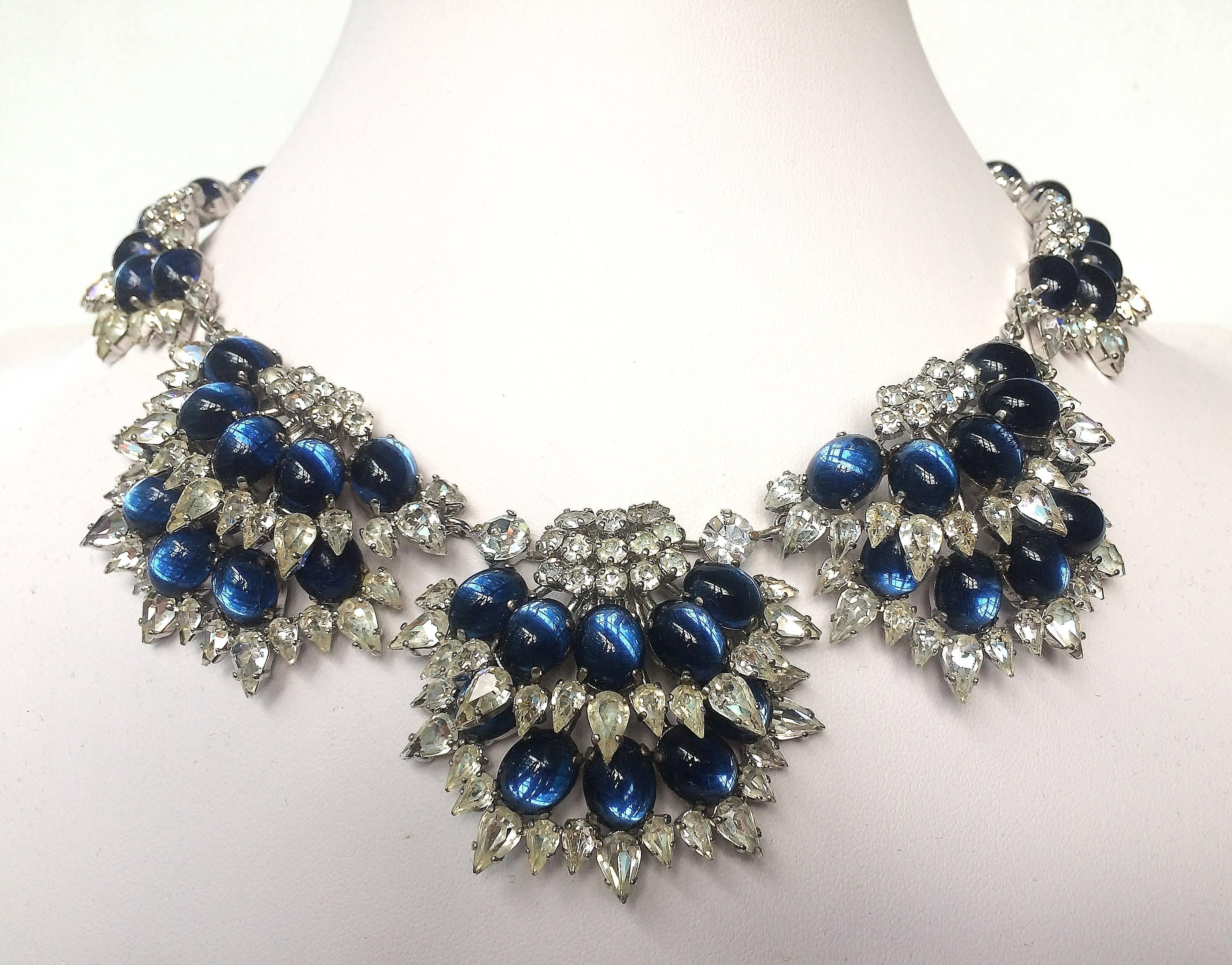 This stunning necklace, the epitomy of Dior glamour, made of many cuts and shapes of paste, including marquise and cabuchon, white and sapphire, which gives this rare necklace an incredible glow. The detailed metal is rhodium plated metal, with a