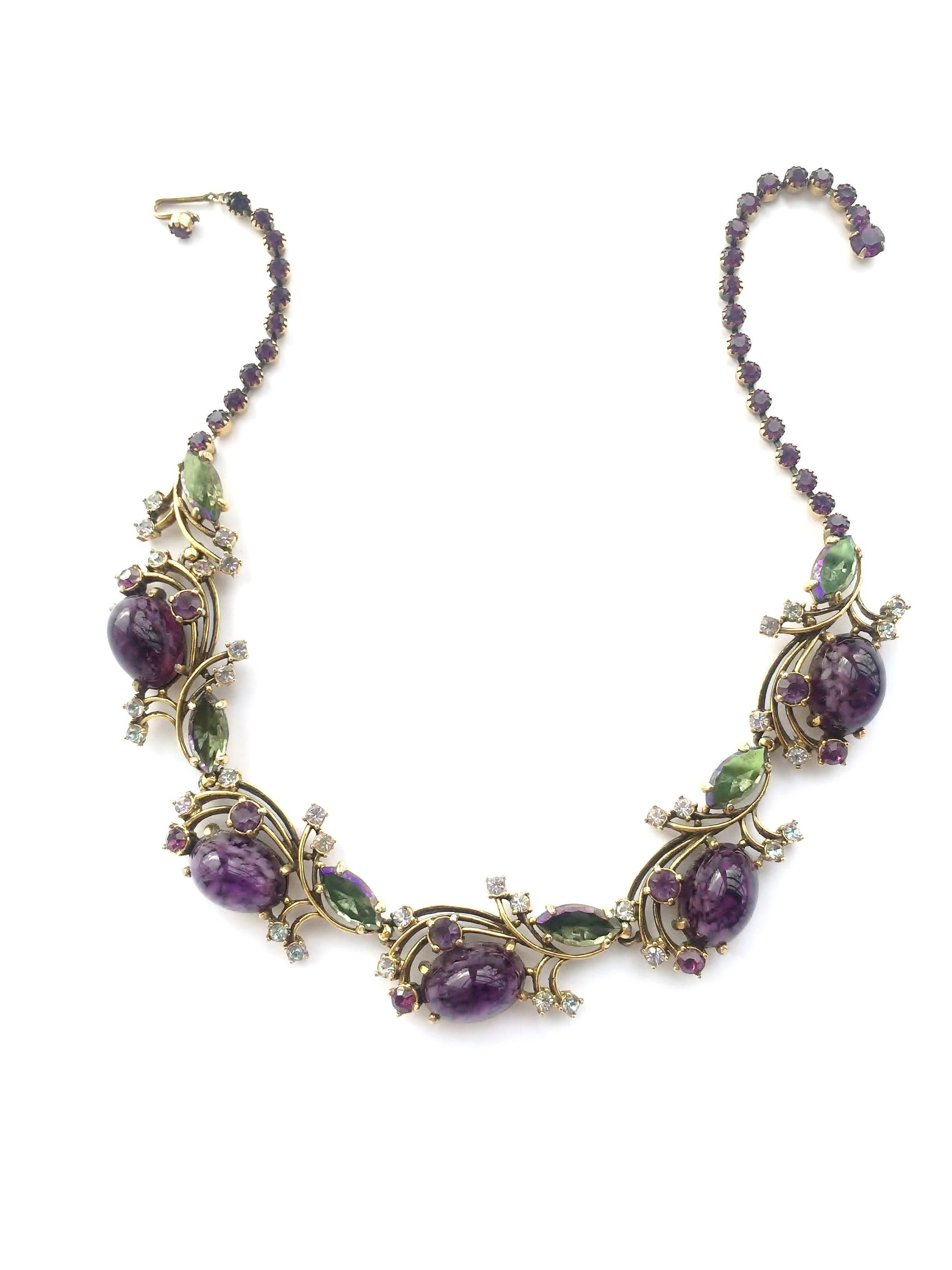 Set with deep mottled amethyst cabuchons, and highlights of deep aurora and light amethyst pastes, this necklace and earrings by the wonderful Elsa Schiaparelli from the mid 1950s, has a poise and elegance to heighten any wearer/outfit. Highly