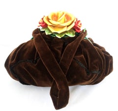 A rare hand coloured celluloid and silk velvet 'rose' handbag, France, 1920s.