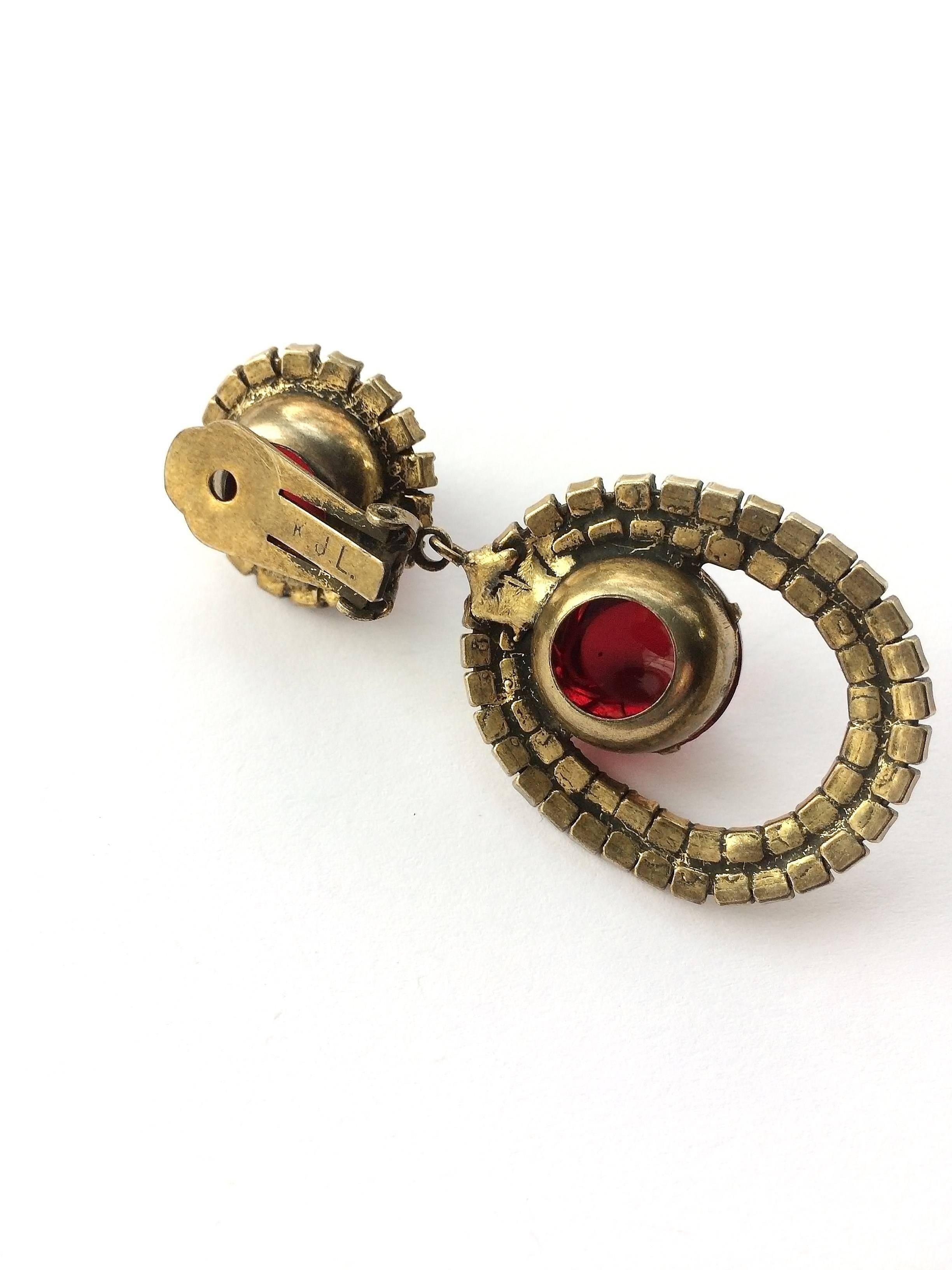 Beautiful, sumptuous Kenneth Jay Lane drop earrings, from the 1960s. A lovely colour combination of ruby and soft grey paste gives a richer antique look. The ruby cabochons are made from resin, thus making the earrings still light to wear.These can