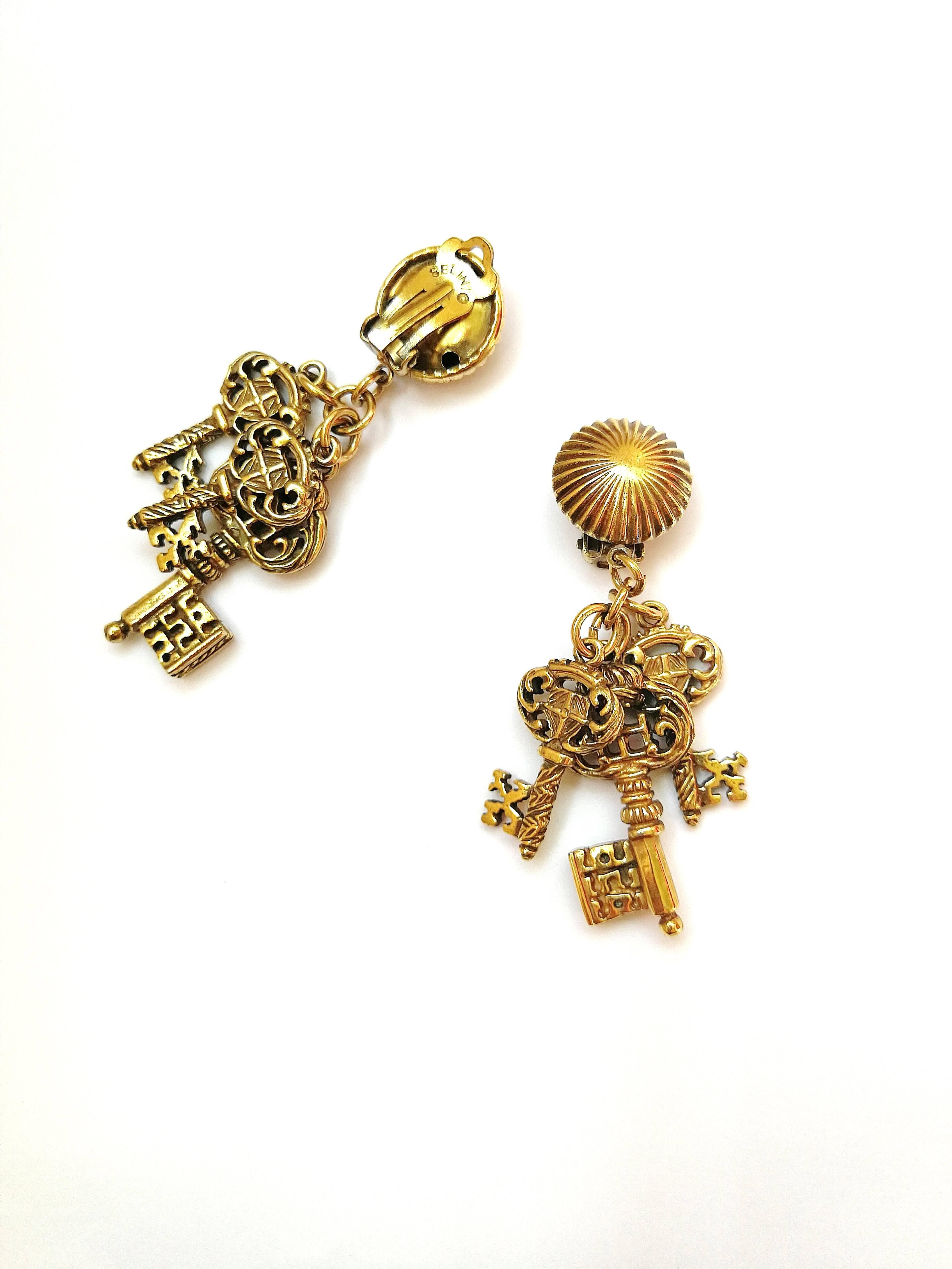 Women's Antiqued gilt metal 'key' drop earrings, Selini, 1960s