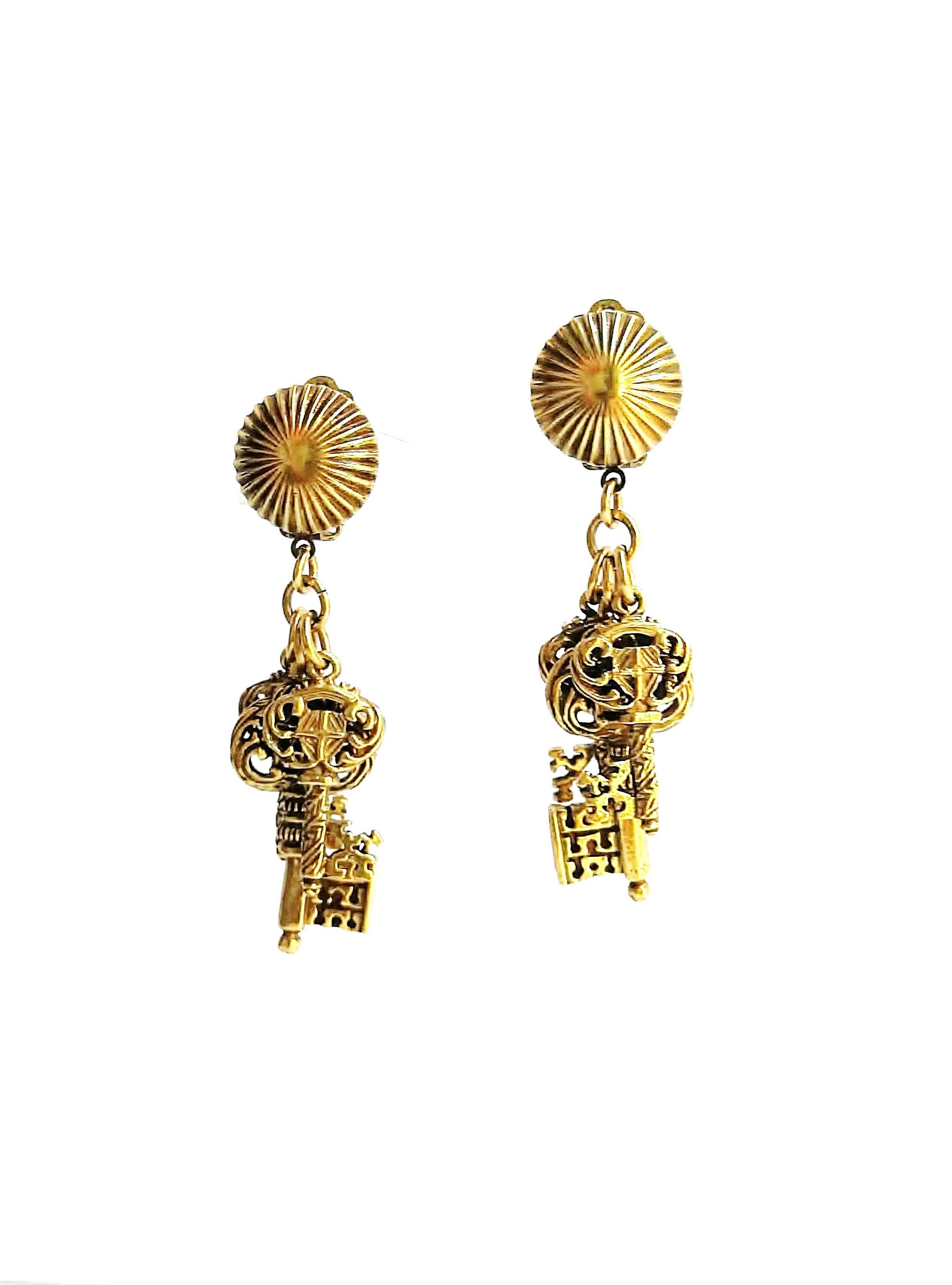 These striking and unusual earrings by Selini, with beautifully cast and detailed keys, are fun and easy to wear, their tone of gold being of a warm and flattering colour.  Eye catching and for all occasions.