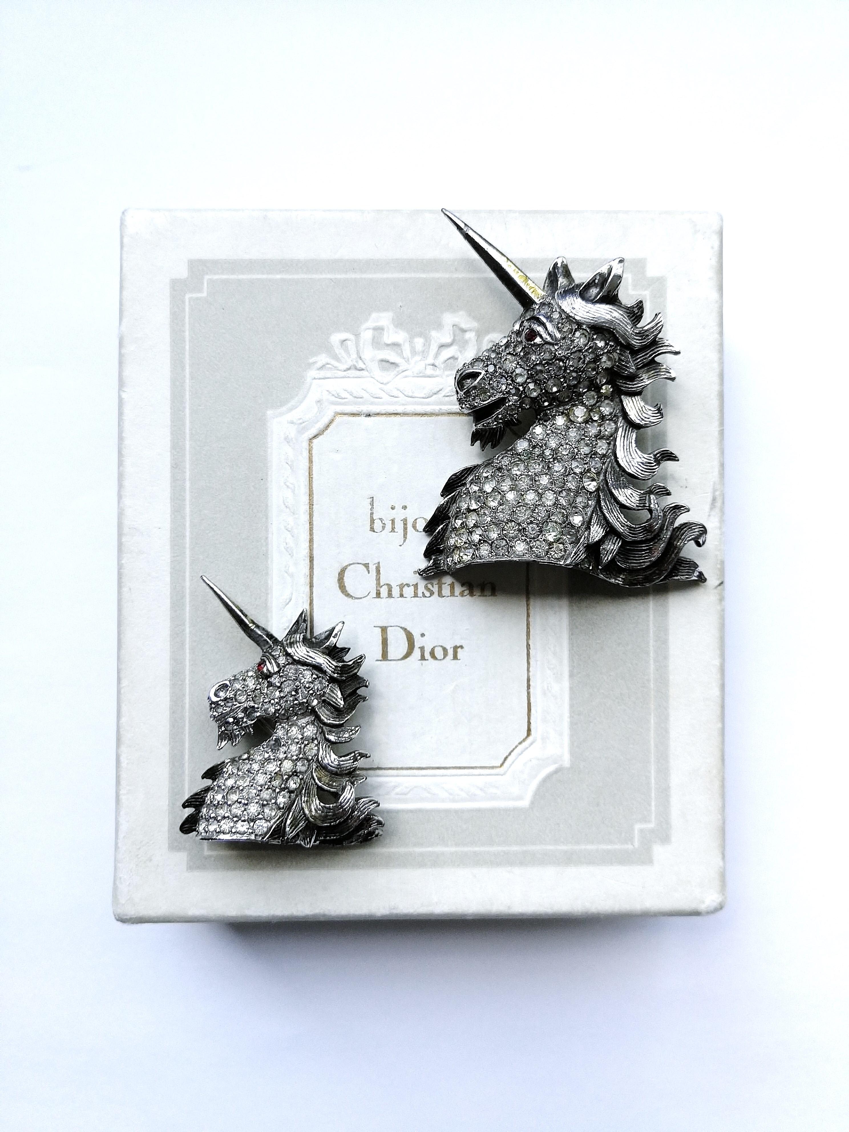 A pair of very rare 'unicorn' brooches from Christian Dior, such magical, exquisite subjects.
Made from base metal with a soft gilding and silvering, and clear pastes, these are one of the most iconic and desirable jewels made by Mitchel Maer for
