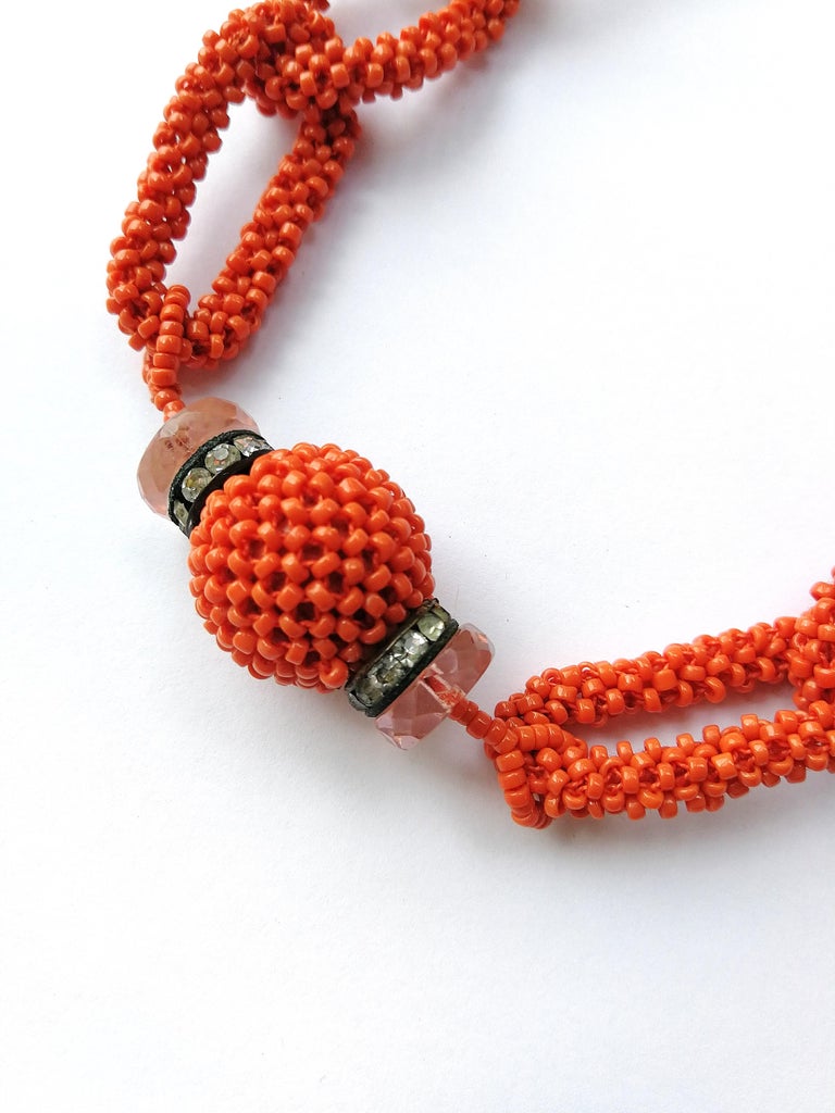 'Coral' glass bead, paste and faceted glass sautoir, French, 1920s. For