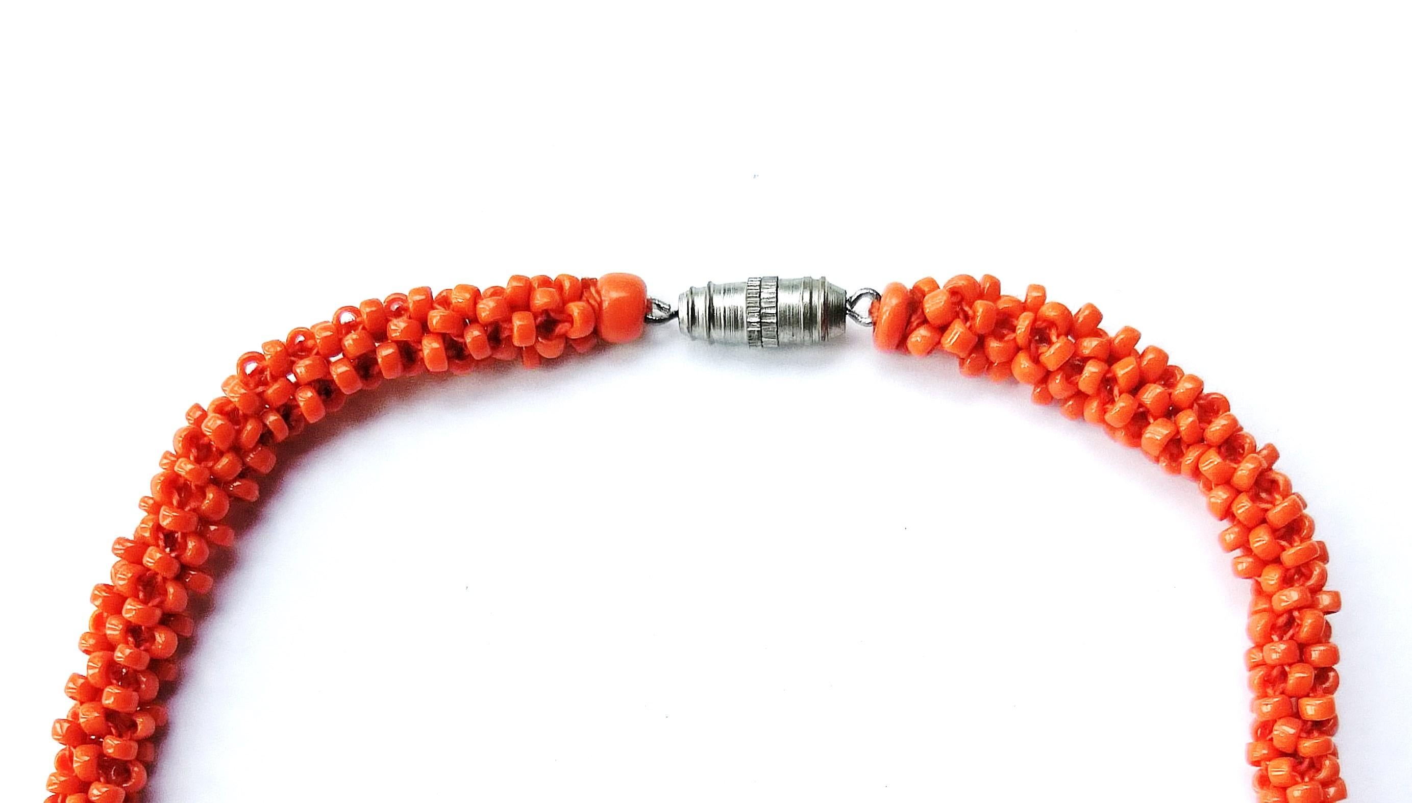 Women's or Men's  'Coral' glass bead, paste and faceted glass sautoir, French, 1920s. For Sale