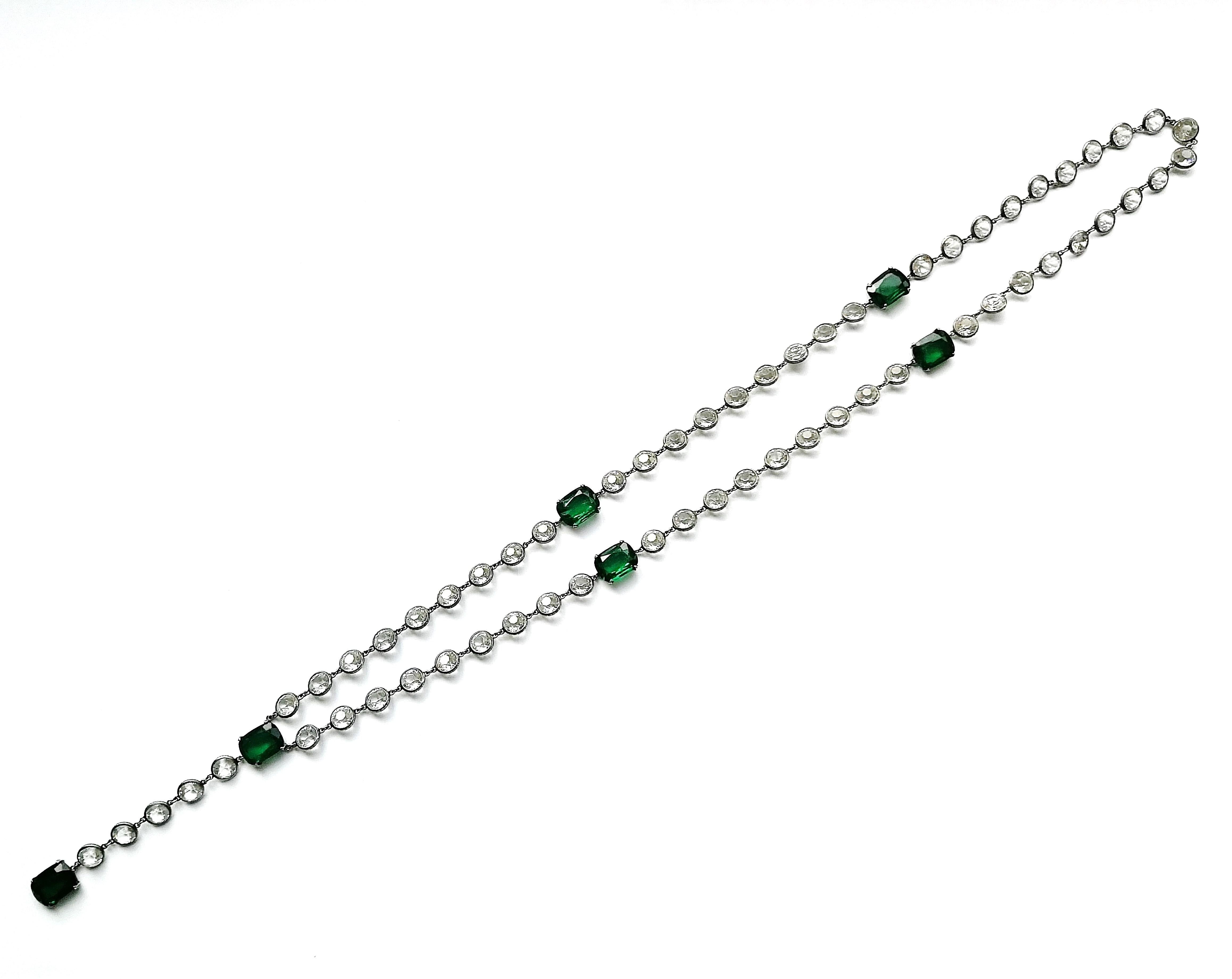 A beautiful quality and very long  'sautoir' necklace, in clear faceted crystals with emerald paste highlights. When set in silver, sautoirs of this style and quality are often attributed to Chanel, whose designs at this time would have had