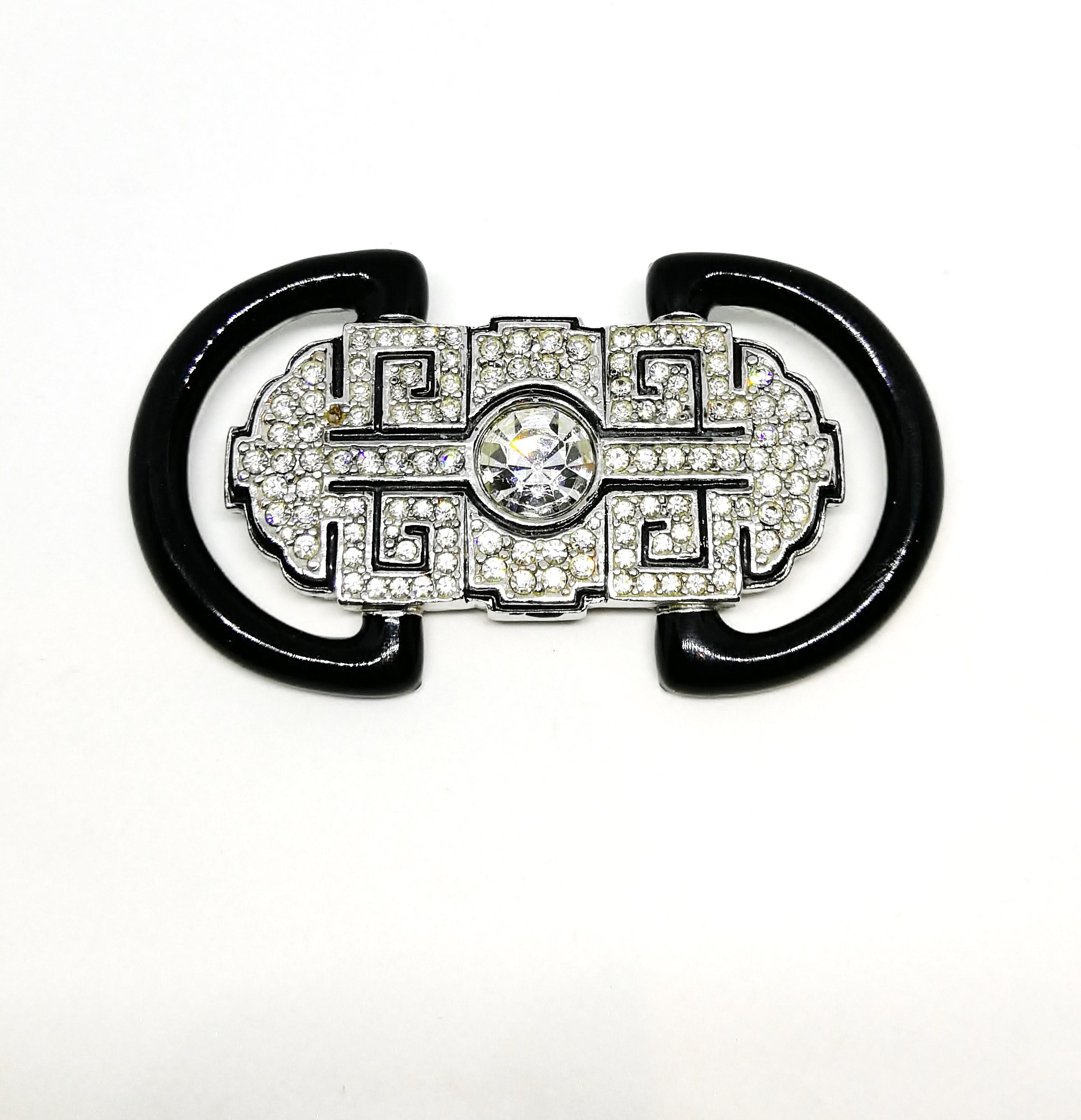A large and dynamic brooch in high Art Deco style from Ciner, New York. Although made from base metal, enamel and paste, it echoes the wonderful designs of Cartier and Van Cleet and Arpels in its wishful, striking style, reflecting the magnificence