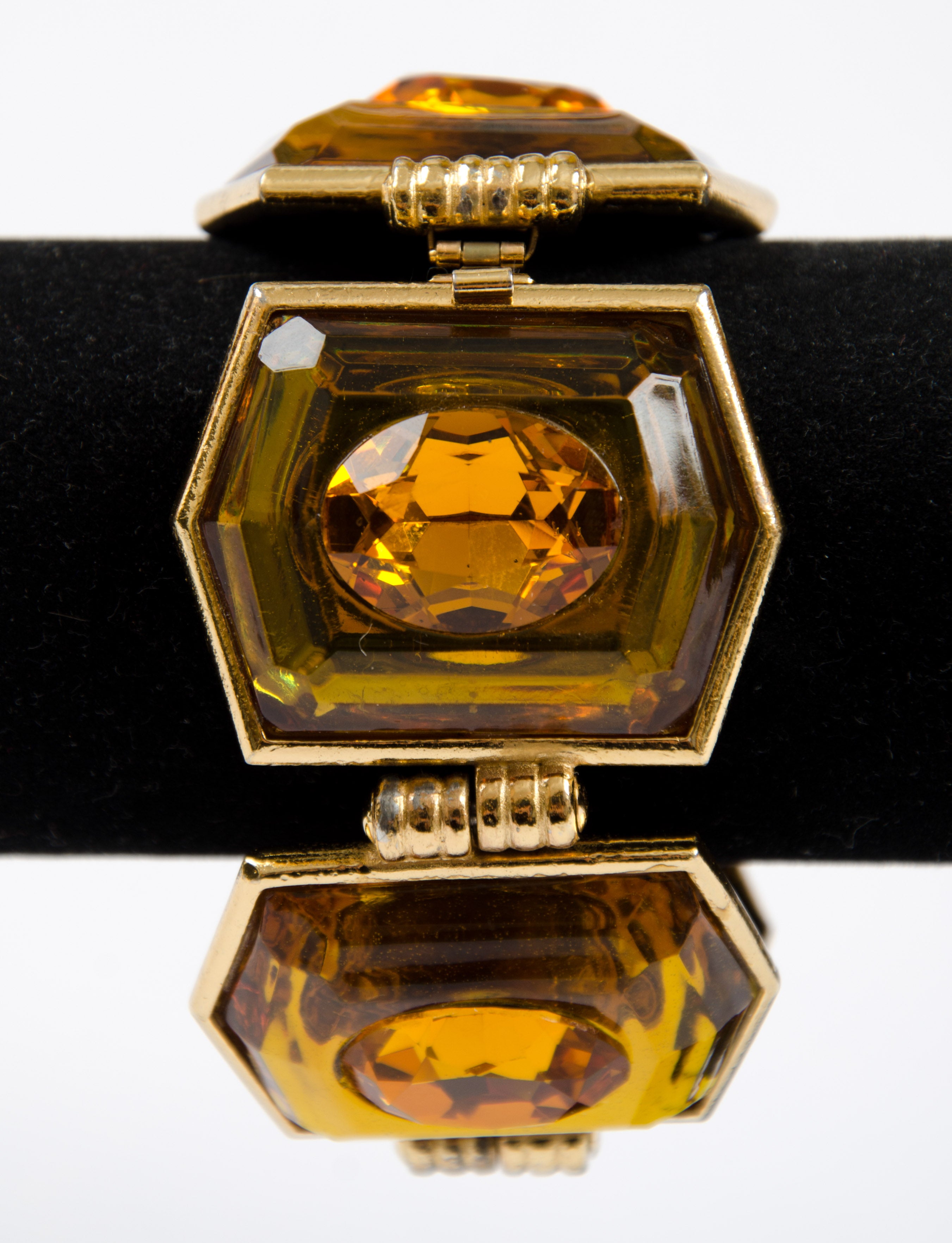 Dynamic and inventive bracelet featuring a paste stone set into Lucite, all in gilt metal. 
Yves Saint Laurent was born in 1936, and became one of the 20th Century’s most famous and prolific fashion designers.
Finding himself at the head of  the
