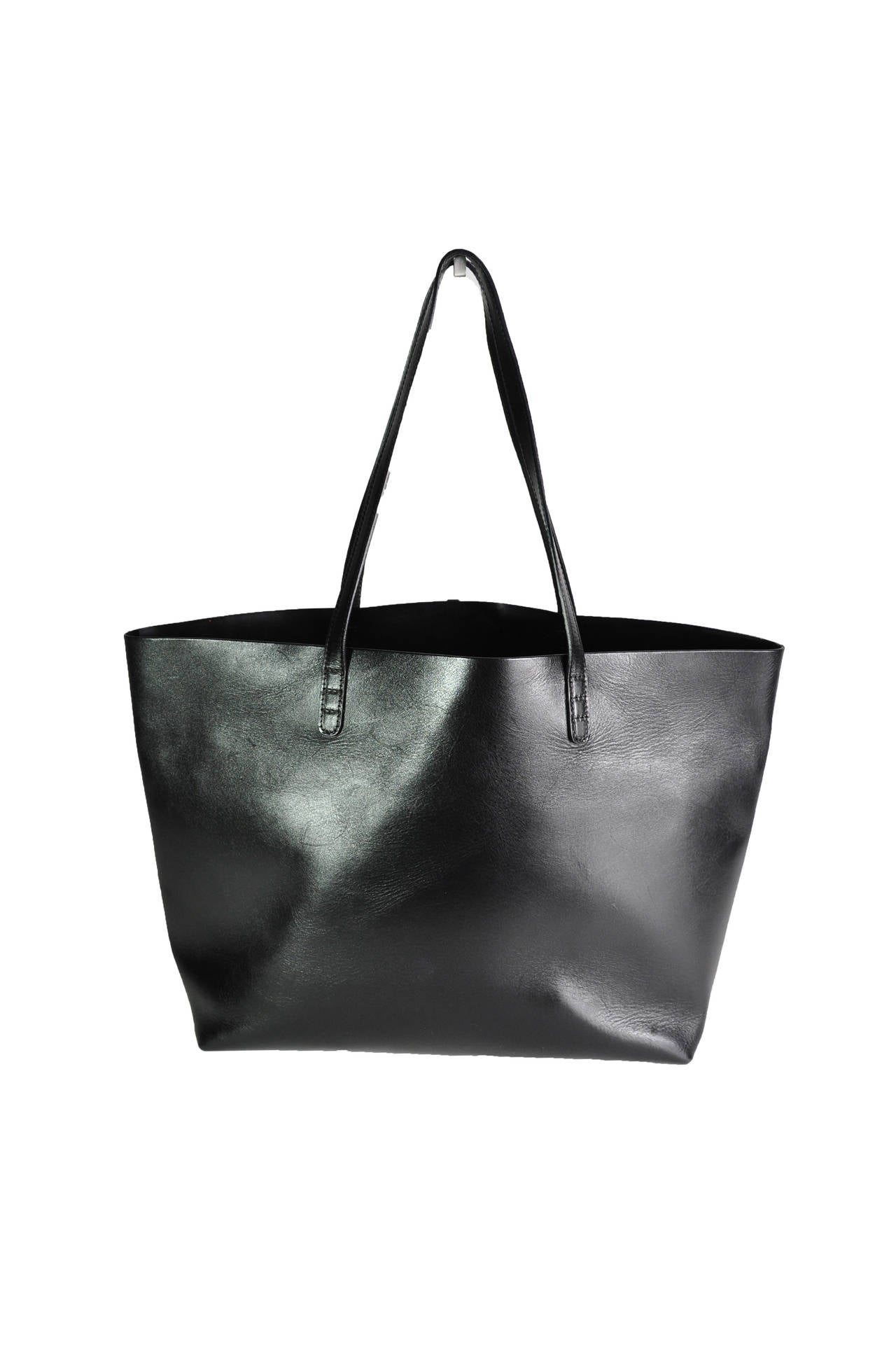 One of the hottest Mansur Gavriel  tote in black calf leather matches with black matte patent interior.  It features with a detachable wallet.
Measurement: Top width: 17.5