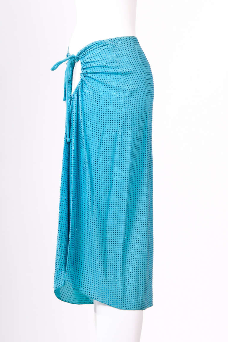 A very dazzling aquamarine hue Swarovski skirt from Celine by Michael Kors features with a drawstring cut out at waist. It's perfect for occasions.