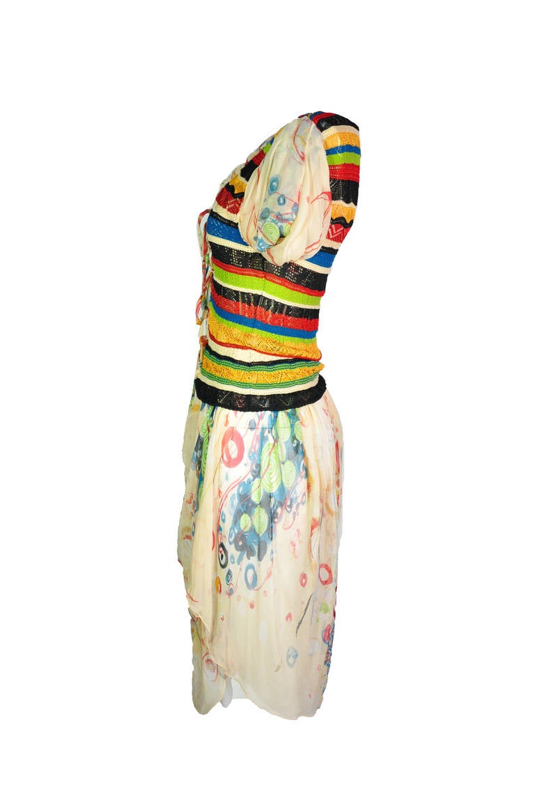 A very colorful pleasant dress from Jean Paul Gaultier which features with multi-color panel knit lace-up top with a very filmsy floral print silk chiffon skirt.