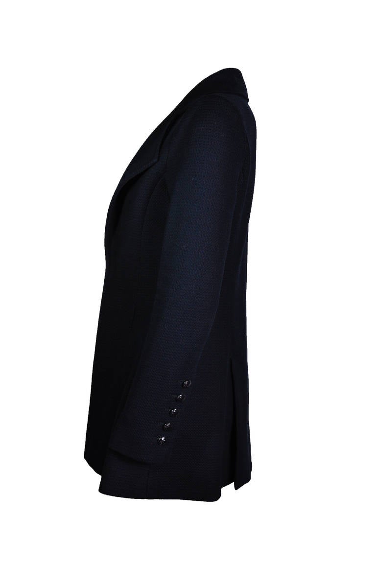 This beautiful tailored A-line fitted and slightly stretchy navy texture cotton jacket is from Chanel 2014 Cruise Collection. CC logo button fastening at front with back vents. CC button fastening cuffs. Fully lined in silk. 