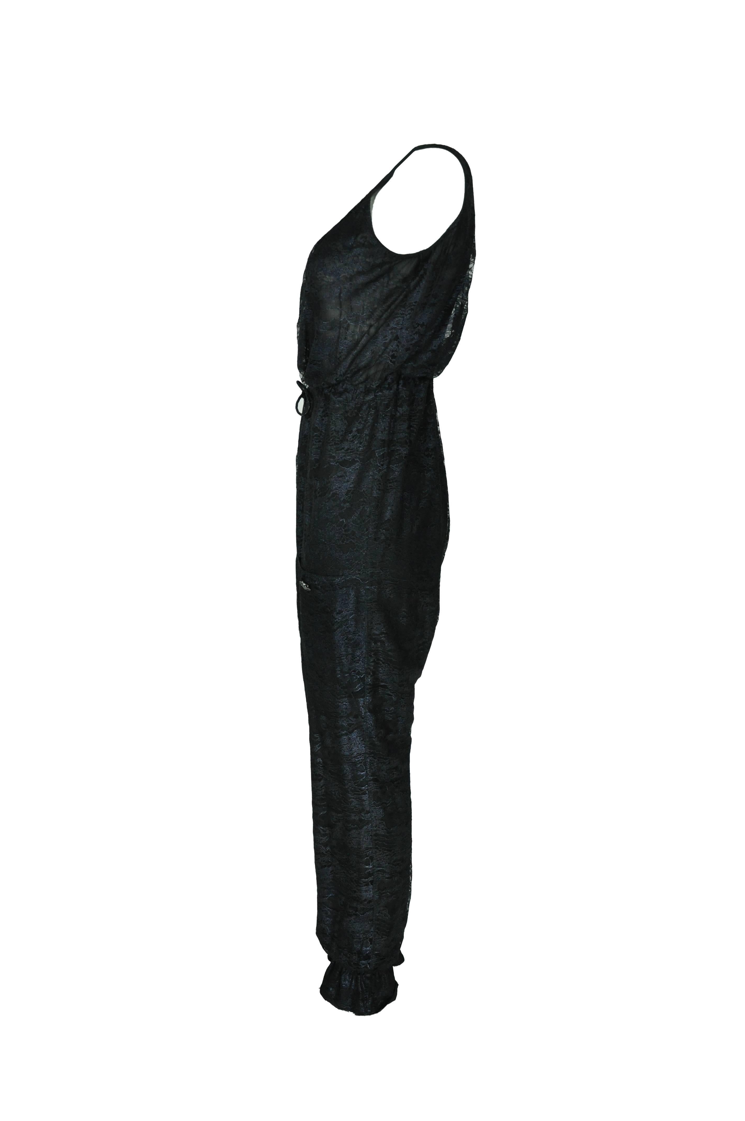 This sleeveless pull on black lace jumpsuit is from Chanel 2012 Autumn collection. It features with the two front pockets and a drawstring at waist.
Fully lined in silk