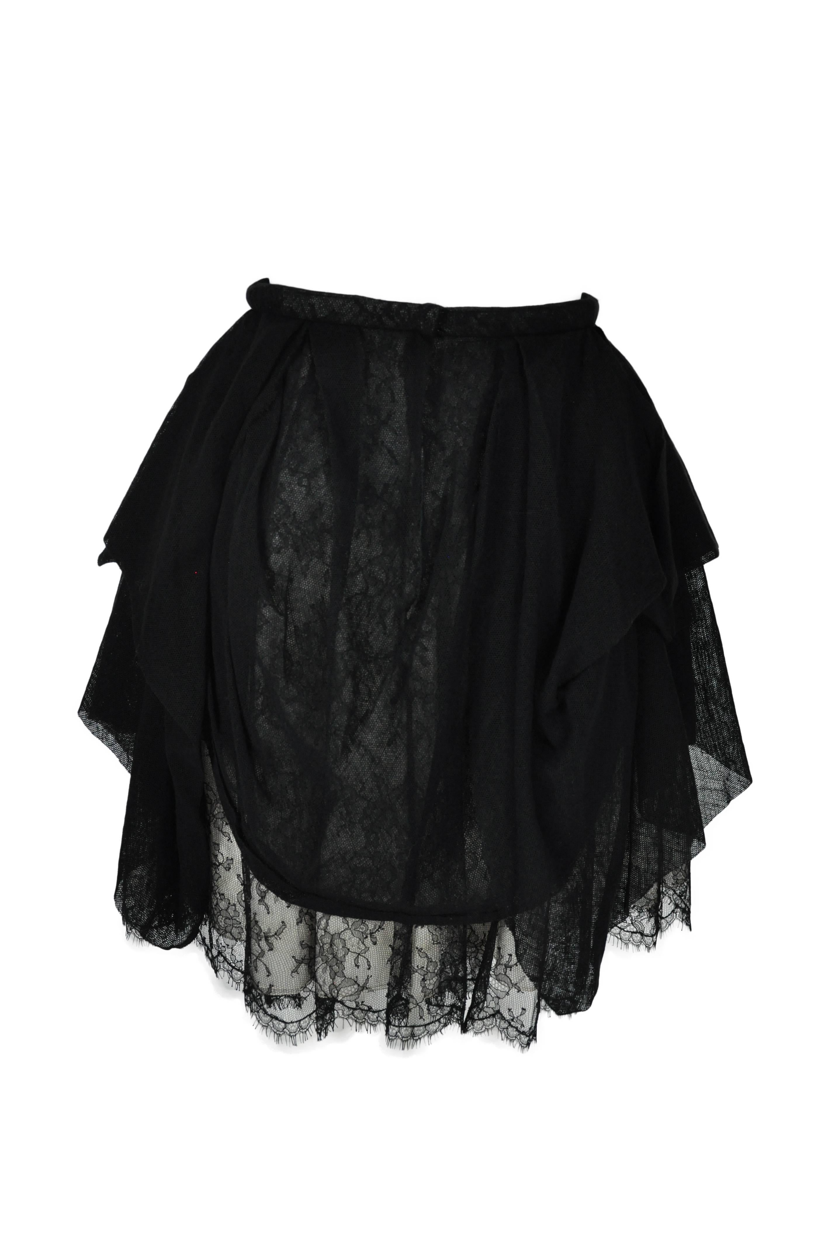 A black asymmetric tulle overlay lace skirt from Chanel 2010 collection.  Fully lined.