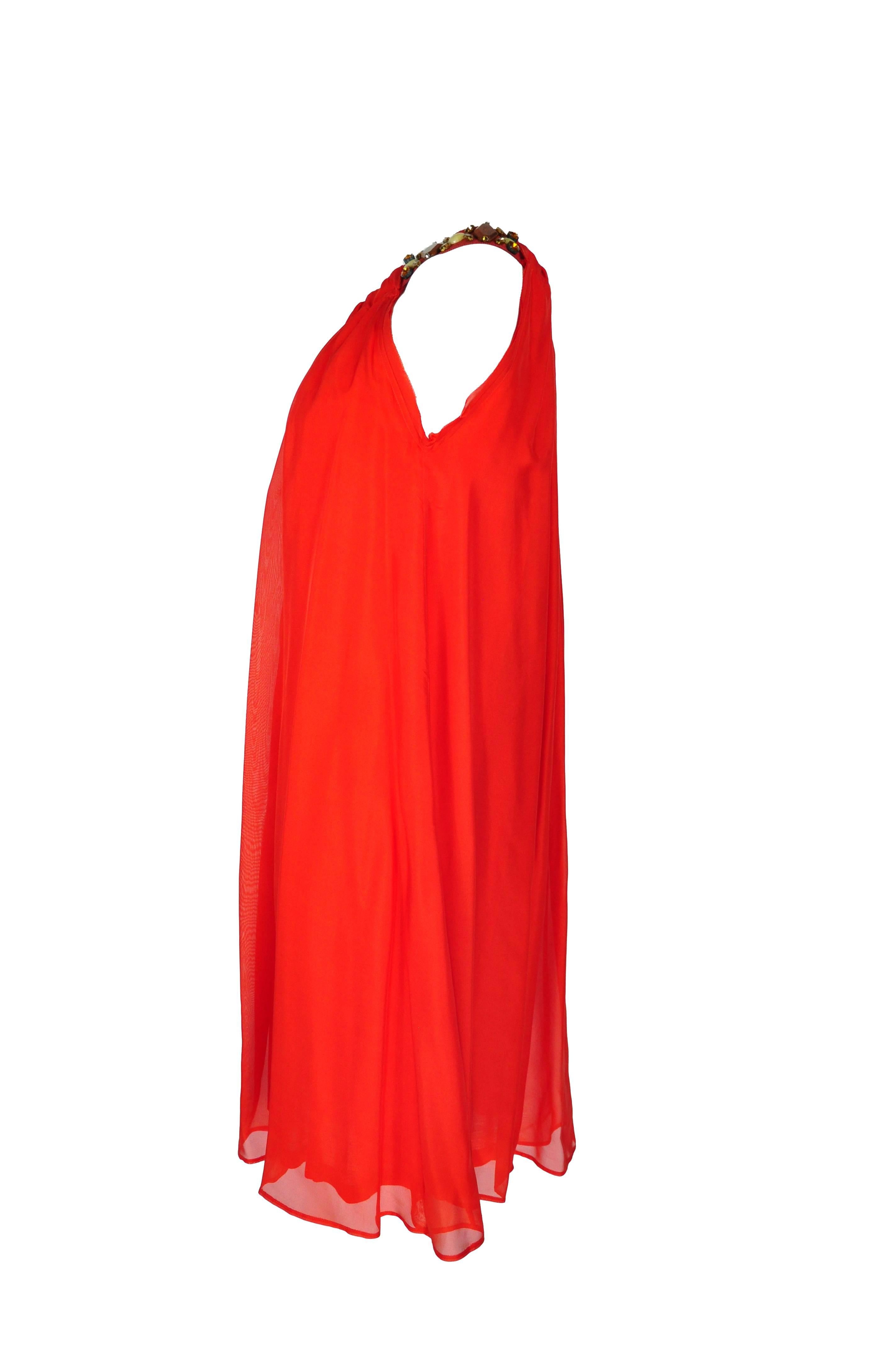 A slightly pleated and loose fit red halter neck silk dress from Lanvin, it features with the embellished grosgrain shoulder straps. Midi length and fully lined. Size is small.
