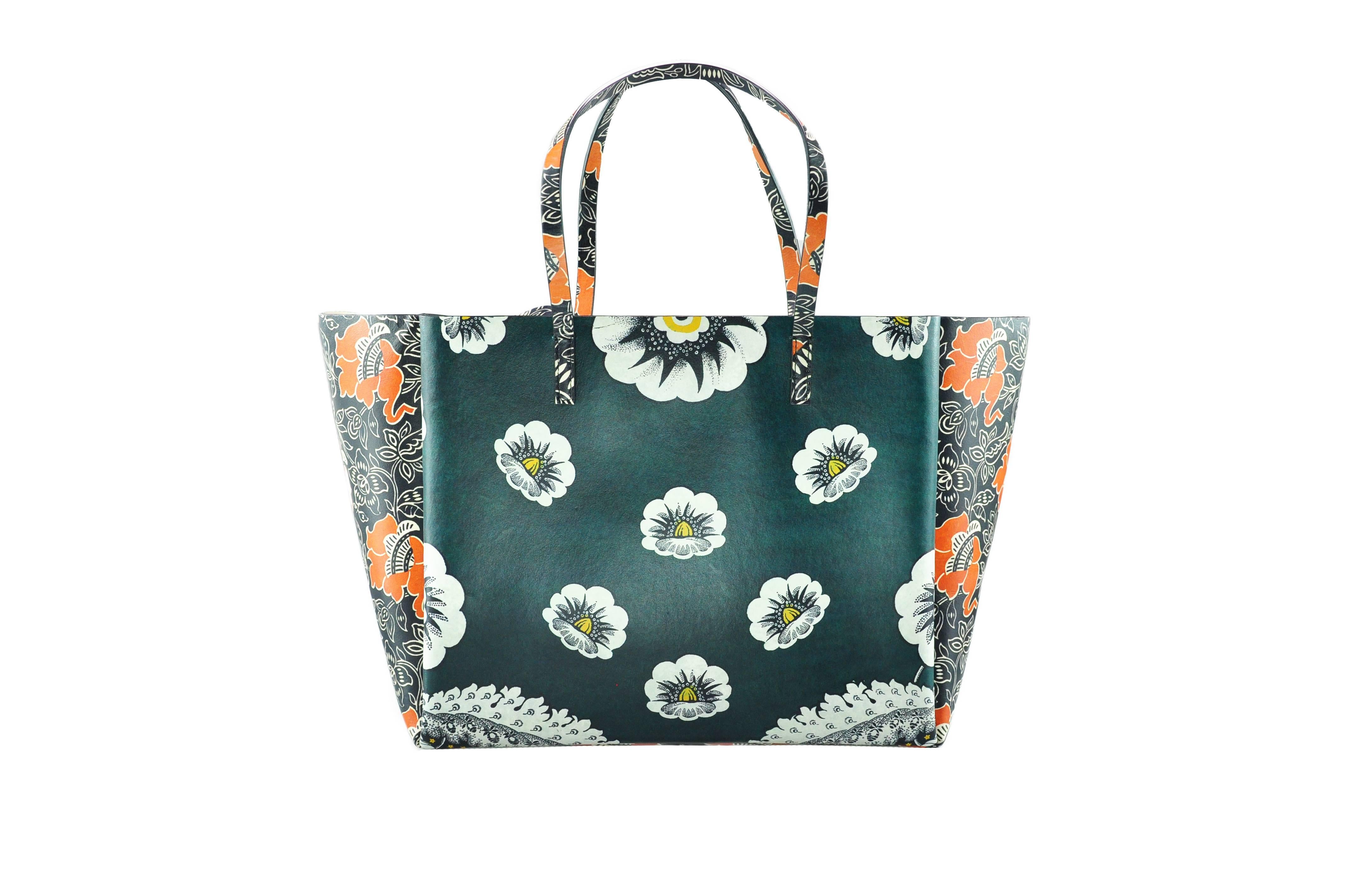 This Valentino Mime tote bag is inspired by the blossoming spring with floral printed patch-work leather.  The sophisticated prints are made with love, embedded into the handbag. Two spacious outer compartments with snap closure and one large zipper