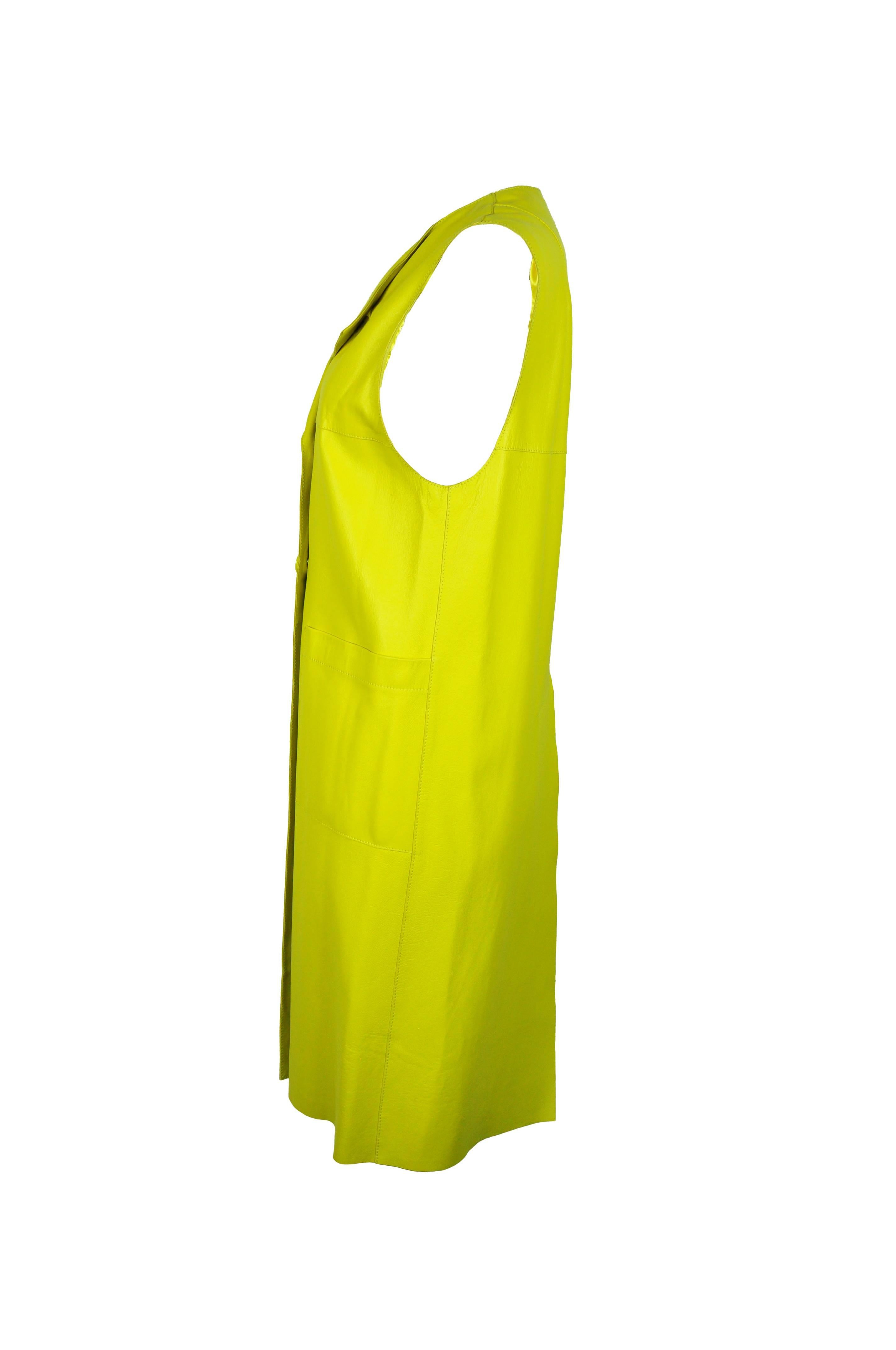 This Marni leather long vest is at very eye-catching lemon yellow color.  Double breasted button fastening at front with two large pockets.  High back vent and fully lined. 