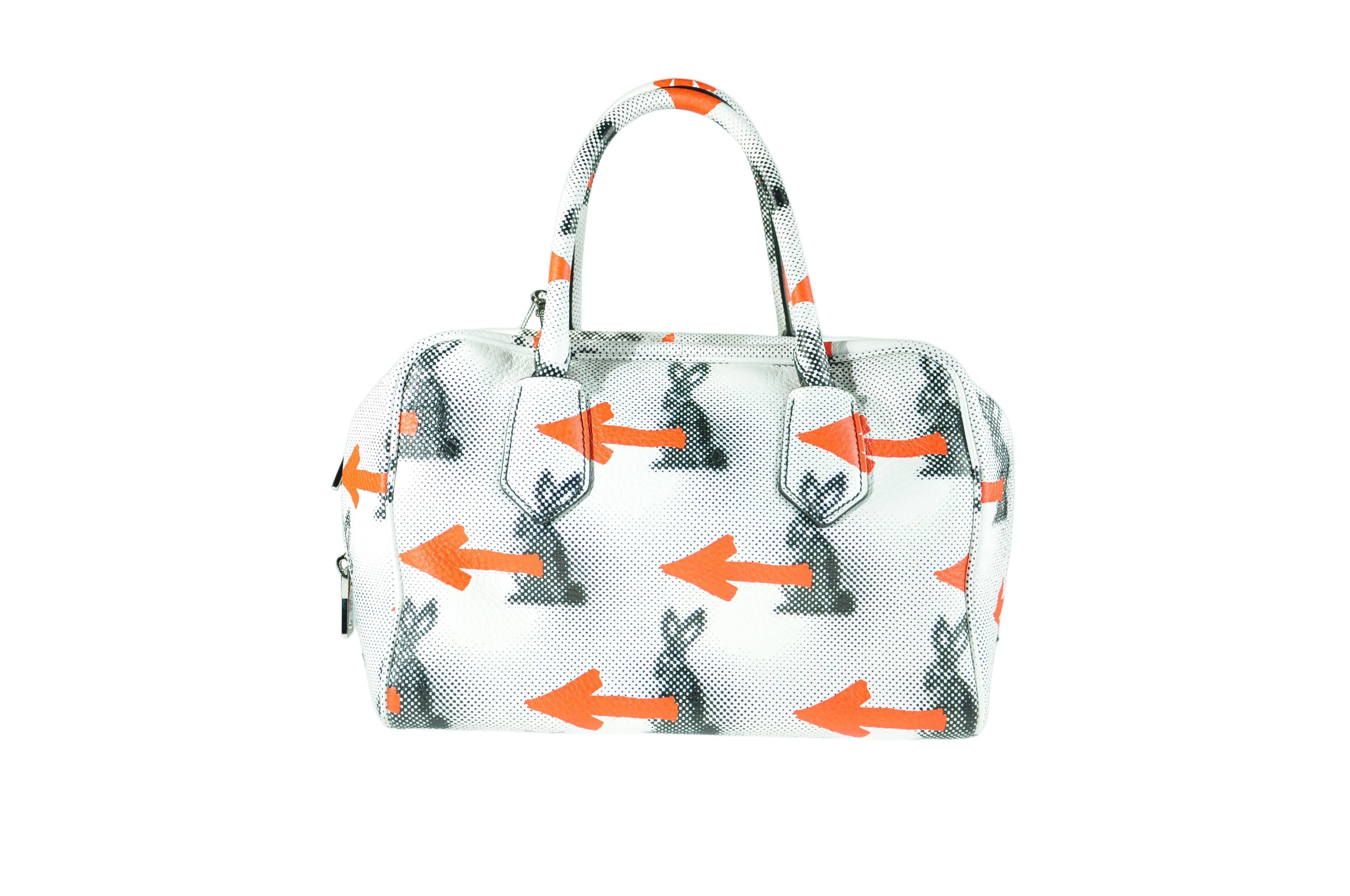 A beautifully crafted from soft calf leather Inside Bag features the bunny and arrow prints on the exterior with a yellow interior bag. Two internal pockets with double leather top handle, detachable and adjustable shoulder strap, zipper