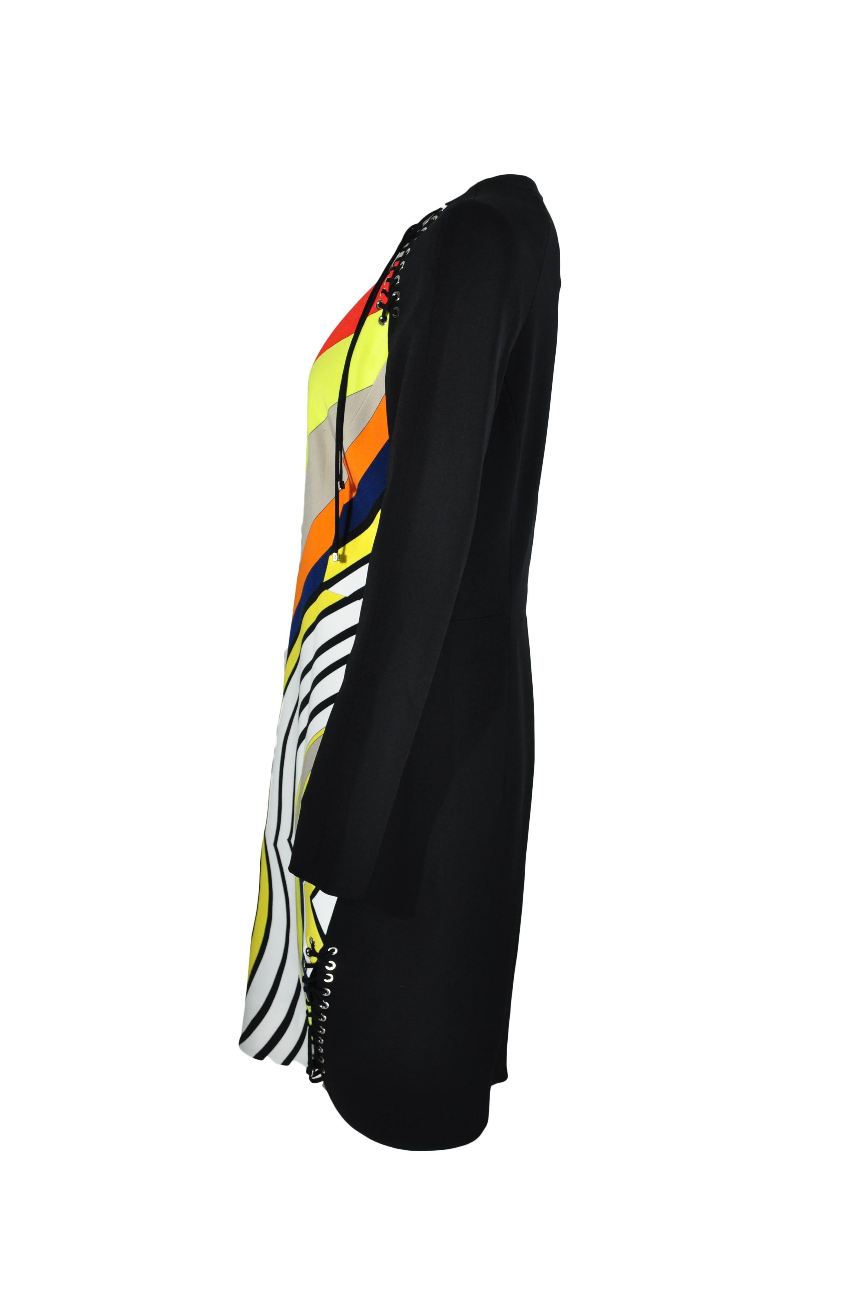 A stretchy and fitted silhouette with vibrancy and swirly print dress from Emilio Pucci 2015 F/W collection.  The black long sleeves features with lace-up details on shoulders and hem. Zip fastening at back.