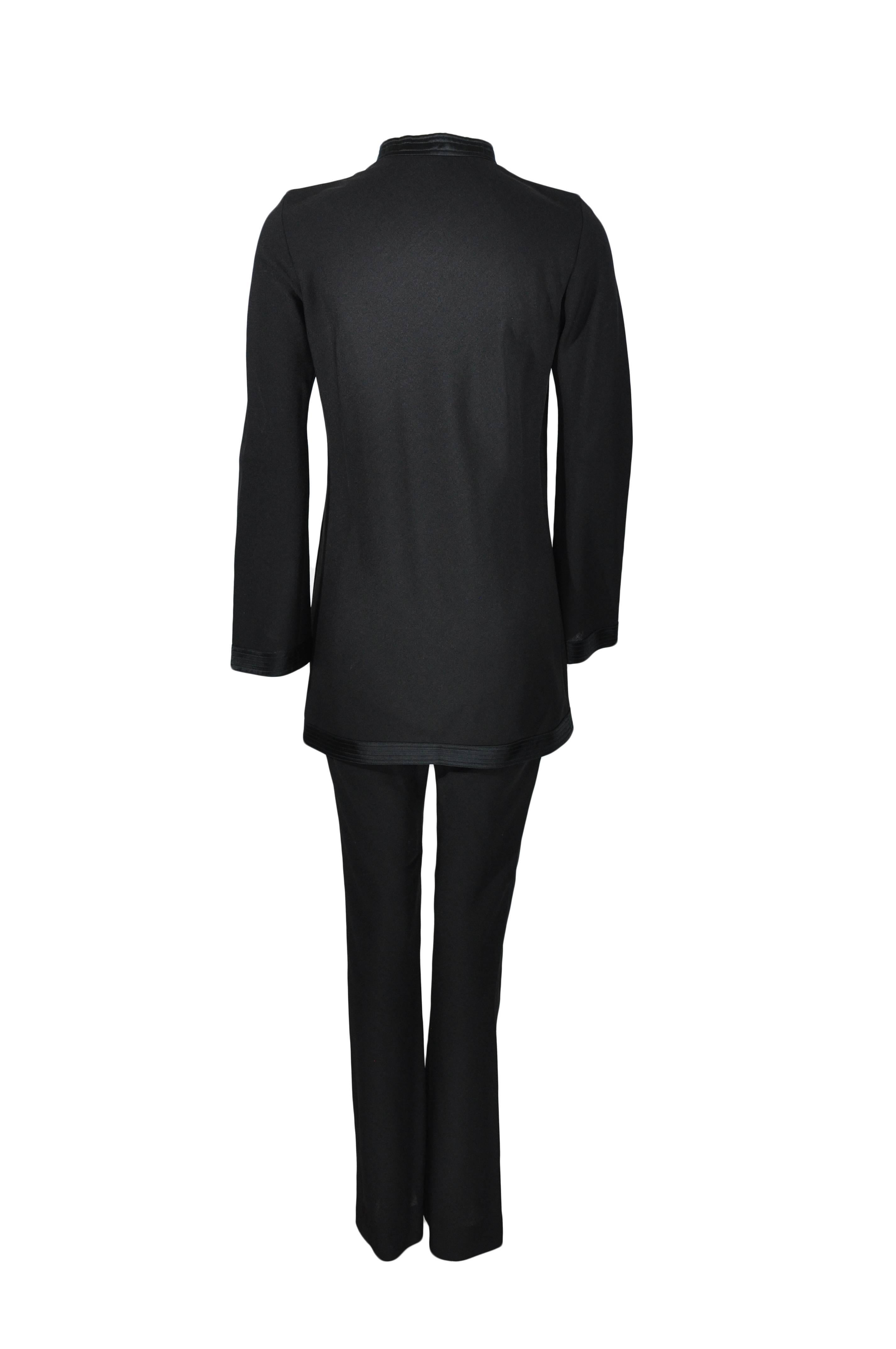 The A-line long sleeves tunic top features with a black satin trimmed mandarin collar and cutout front, snap fastening at neck with a detachable patent leather daisy.  The  pants are trimmed with black satin at waist and decorated with a detachable