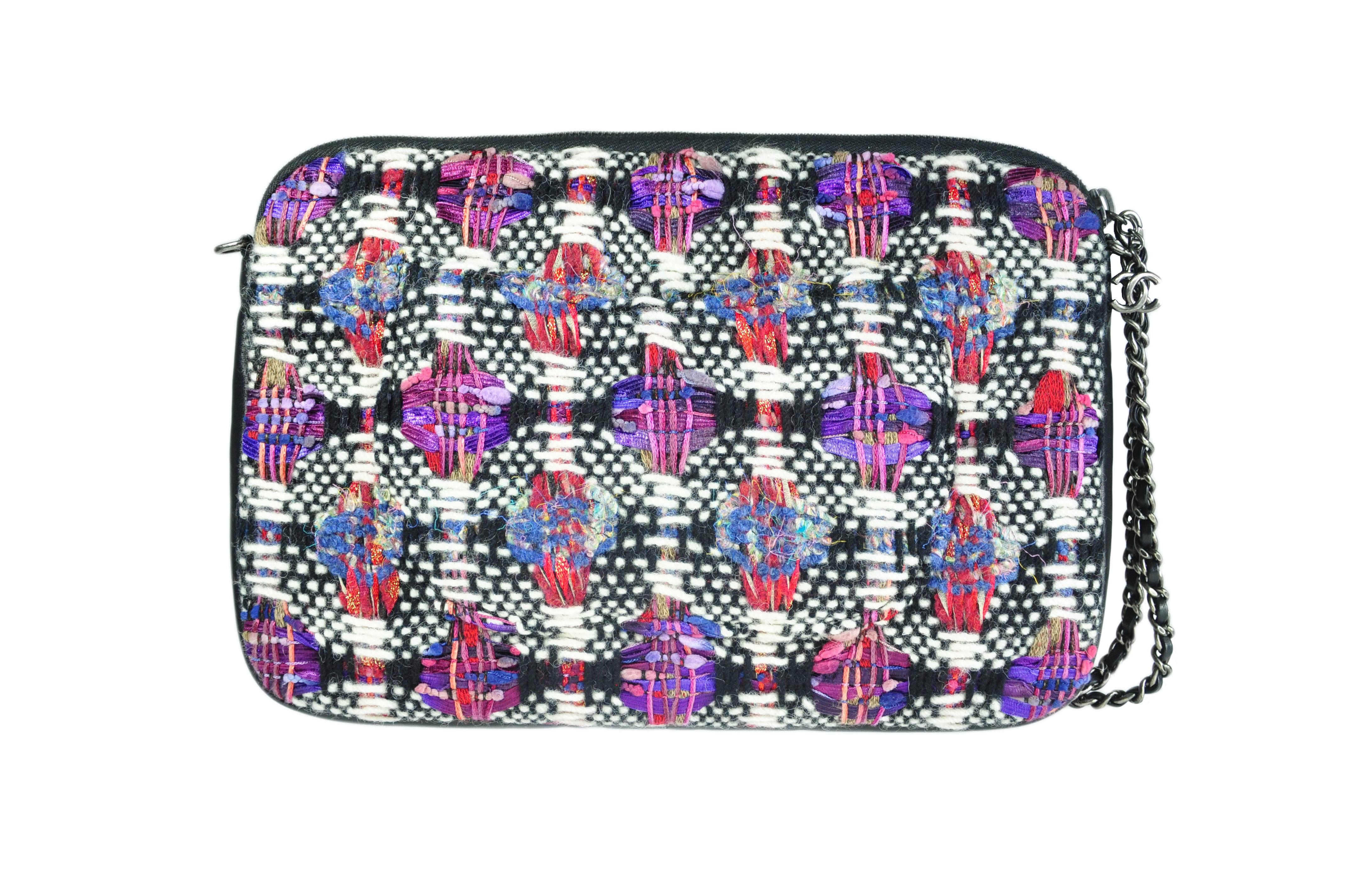 This multi-color tweed and leather trim iPad clutch with chain is from Chanel 2016 Fall/winter runway collection. It features with one large front snap patch, two small patches and one rear patch.  Top zipper with a CC logo charm and a long