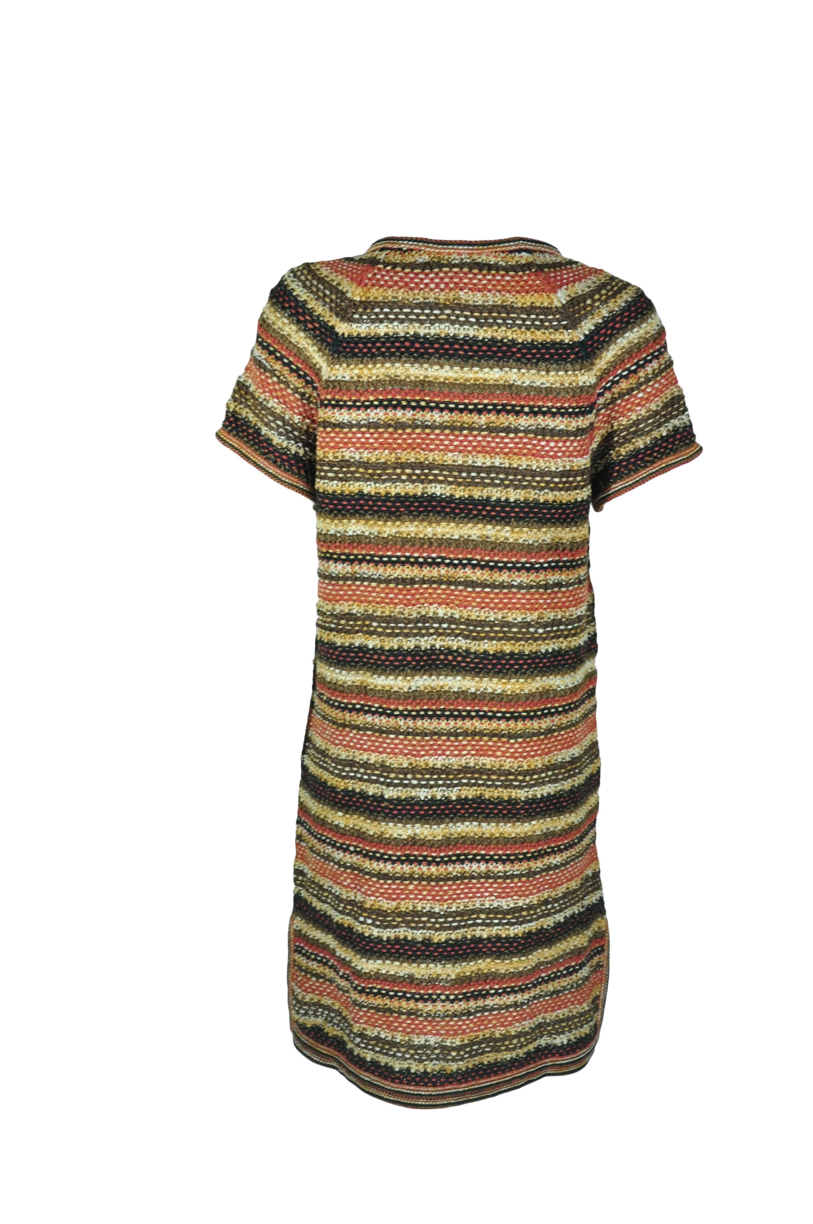 A slip-on multi-color knit dress from Chanel 2018 resort collection.  Crew neck gold toned button fastenings along front with two pockets.  