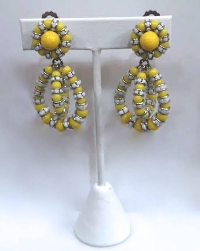 The iconic earring style from Francoise Montague in yellow glass and white crystals. These clip earrings dance as you move and are universally flattering. A must have addition to any collection. 