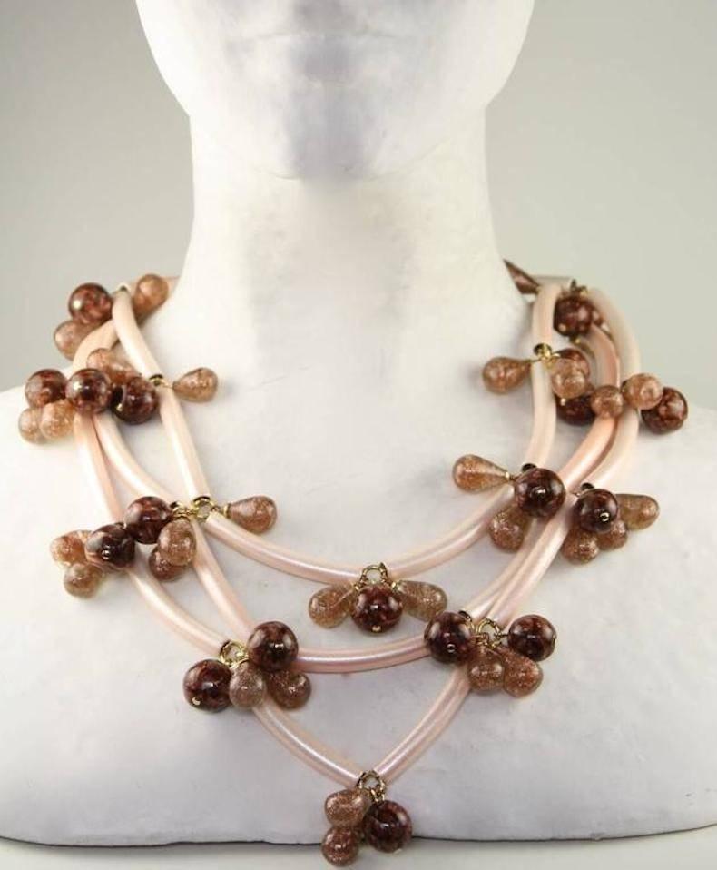 Iridescent pink metal tube and vintage glass with gold specks necklace from Francoise Montague. 

17