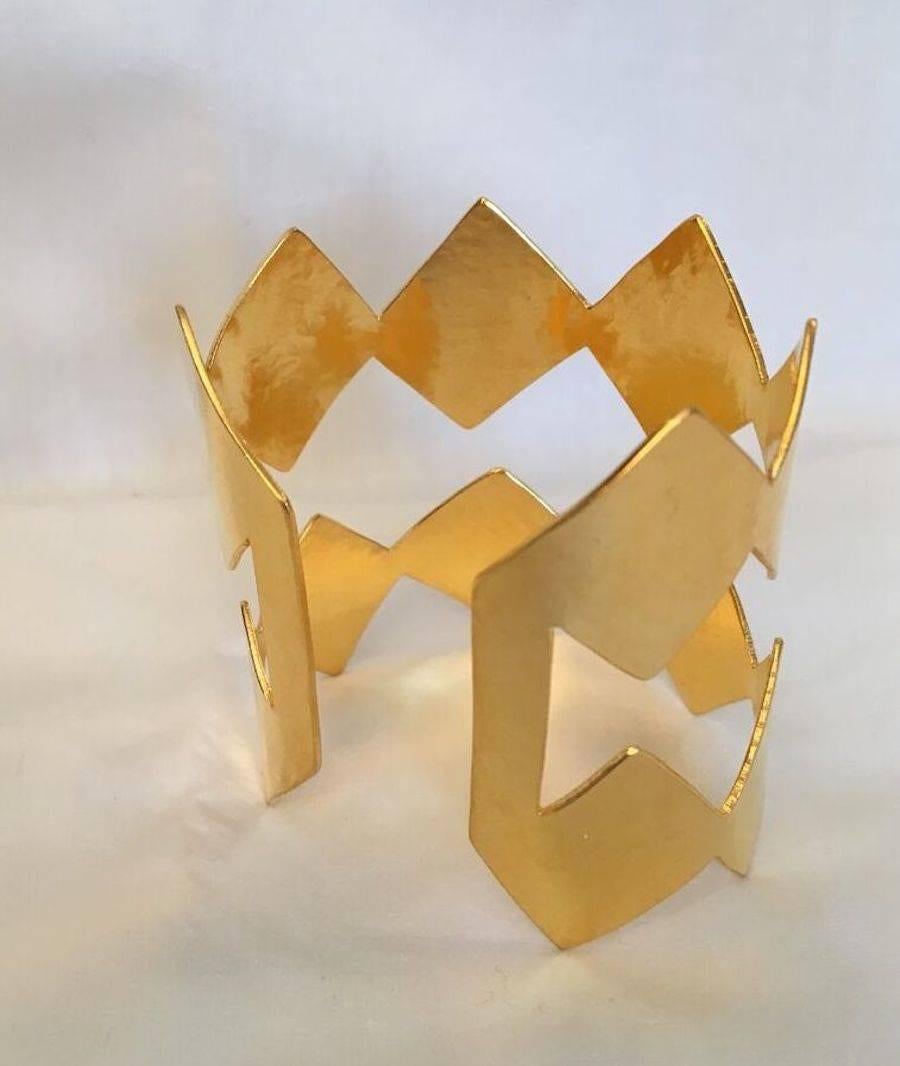 Double band diamond shape cuff bracelet from Herve van der Straeten. Incredibly lightweight statement piece, molds to both small and large wrists. 