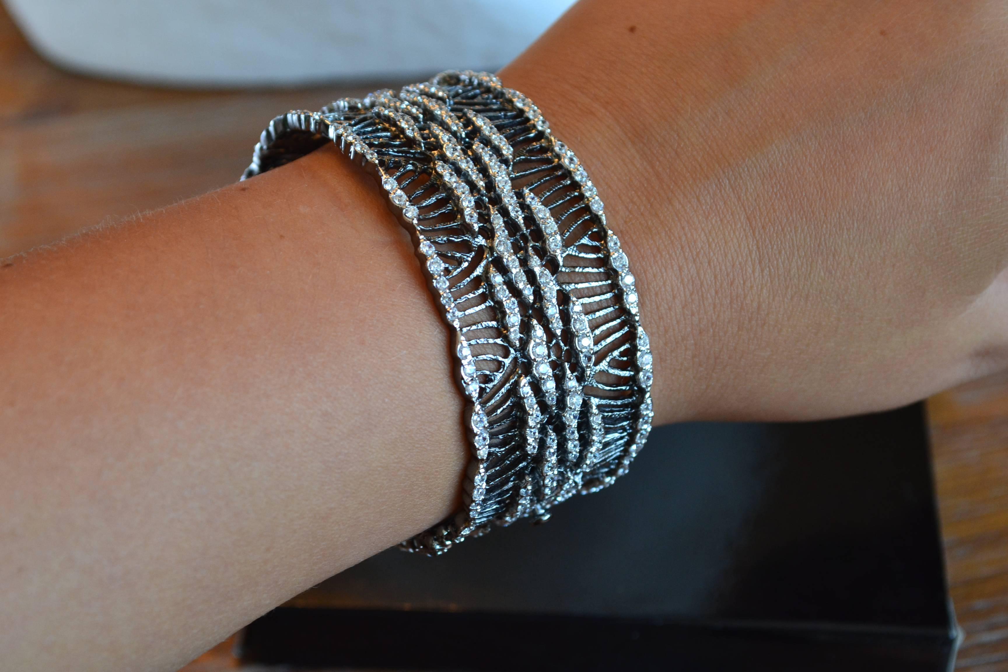 Gorgeous rhodium and CZ bracelet with wave motif. 