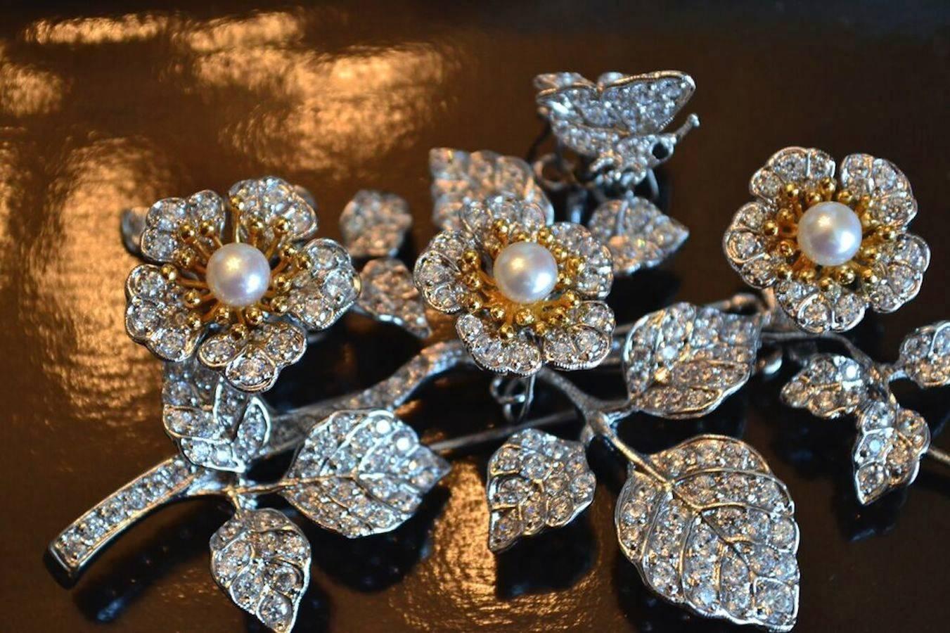 Triple flower bouquet with Japanese pearls, Cubic zirconia, sterling silver, and gold plate.