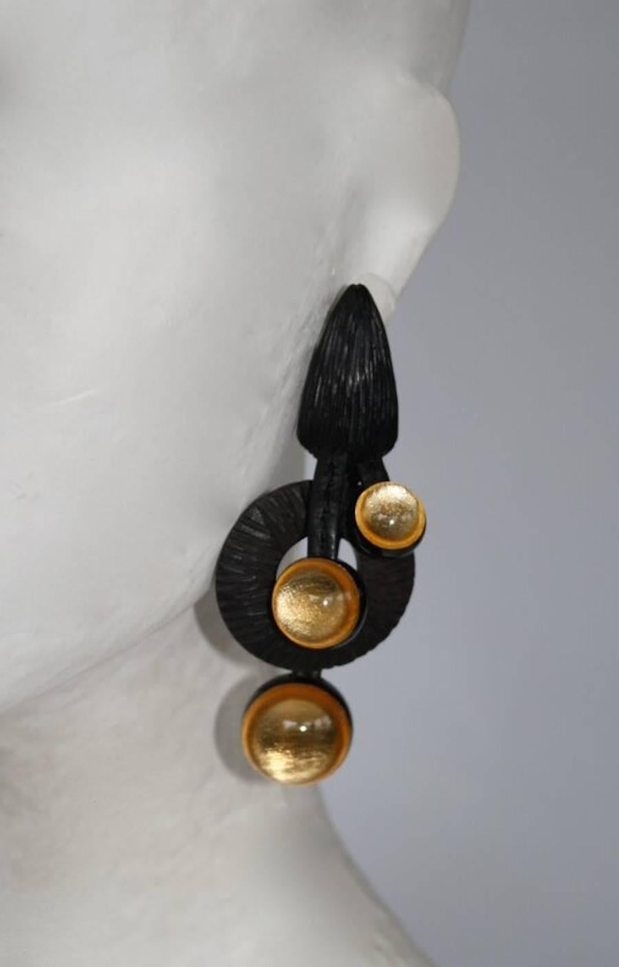 Gorgeous and unique leather, wood, and glass clip earrings from Monies. 