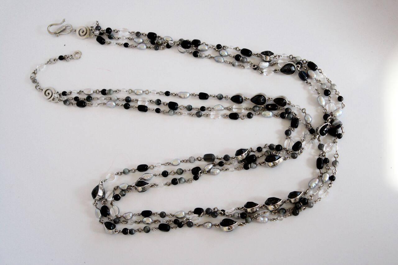 Long necklace with black Onyx and pearls set in palladium from Goossens Paris. Can be wrapped multiple times and worn short as shown in images. 

45