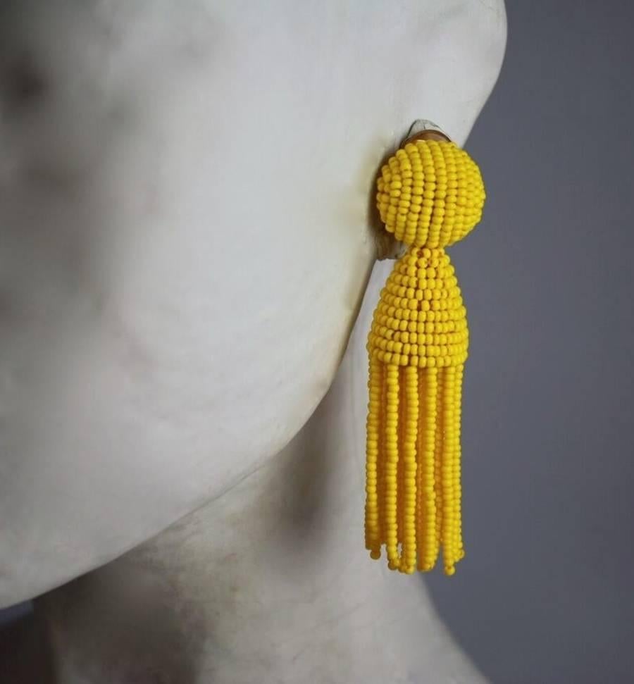 Yellow glass bead tassel clip earrings from Oscar de la Renta. 

3