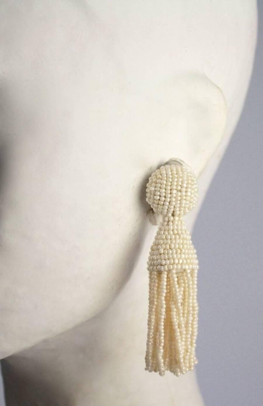 Ivory glass bead tassel clip earrings from Oscar de la Renta.   

3