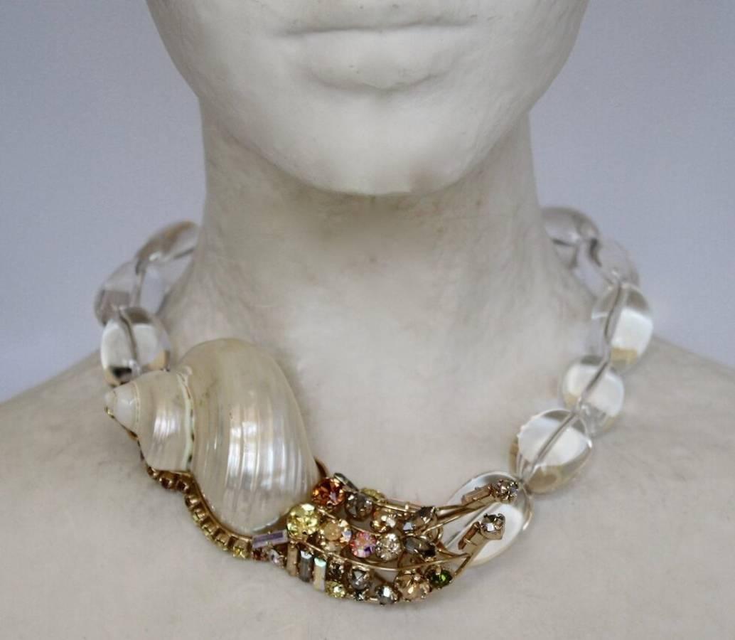 Rock crystal, shell, and Swarovski Crystal snail motif necklace from Philippe Ferrandis. Limited series. 

16
