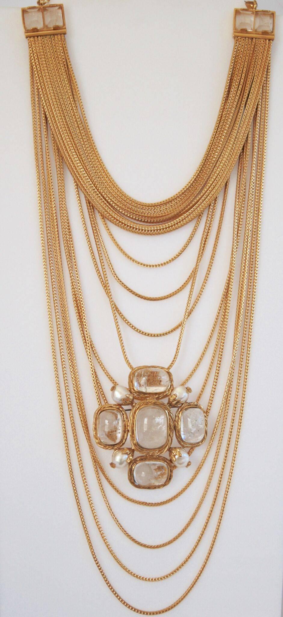Goossens Paris gilded brass multi chain necklace with rock crystal detailing. The chains are a gorgeous shade of gold and are made to hold decorative pins (sold separately). 

First layer of necklace is 13