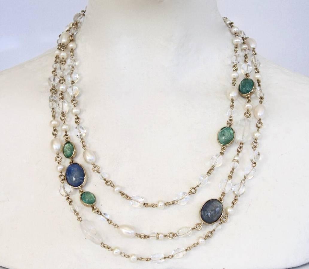 Goossens Paris triple row necklace with clear rock crystal, hand tinted rock crystals in shades of blue, and pearls. 