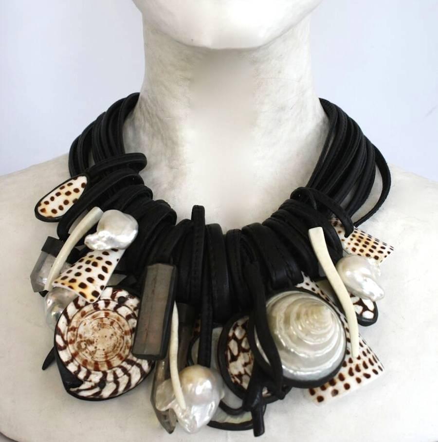 Monies one of a kind multi strand leather necklace with baroque pearl, mountain crystal, shell, ebony wood, mother of pearl, and copper drops.   18