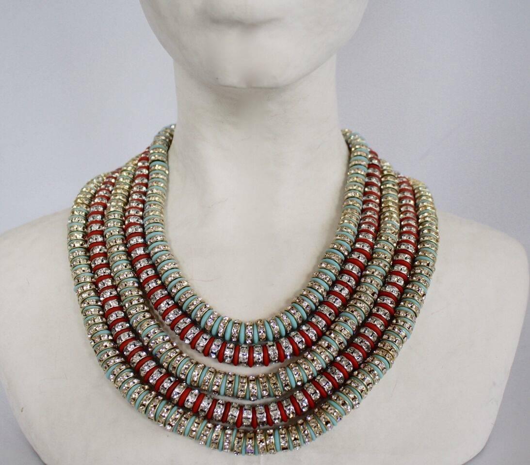Red and turquoise glass rondelles are strung between silver and clear Swarovski crystal rondelles in this five strand necklace from Francoise Montague. This piece is incredibly lightweight, despite its large stature. A gorgeous addition to any