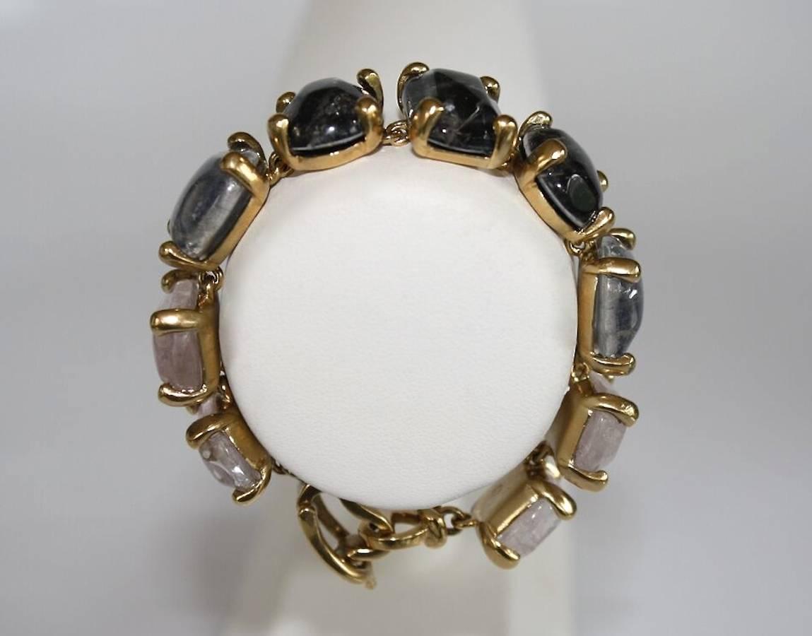 Hand tinted rock crystal and gold plate bracelet in shades of Tourmaline and Sapphire from Goossens Paris.