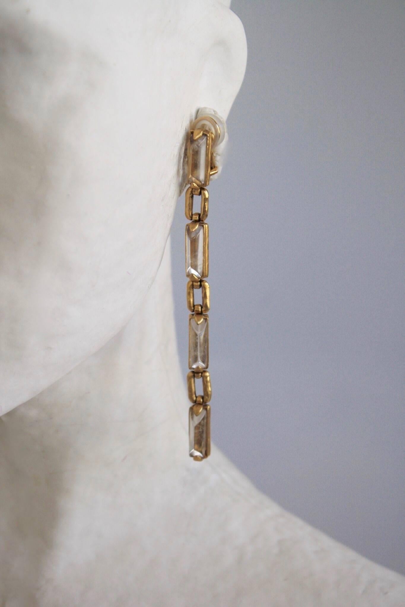 Long clip earrings made with rock crystals and gold links from Goossens Paris. 

4.5