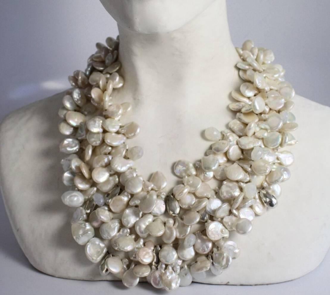 An incredible piece from Patricia von Musulin made with gorgeous keshi pearls and sterling silver beads. Hand strung on luxurious Japanese silk and finished off with a solid sterling silver clasp. 