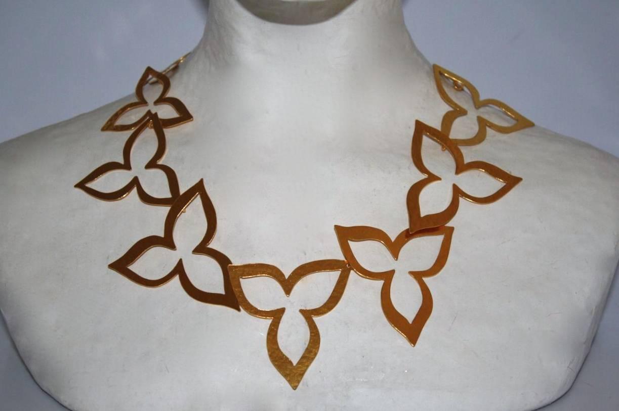 Gilded brass hand hammered cutout petal necklace from famed jewelry designer Herve van der Straeten. 

17
