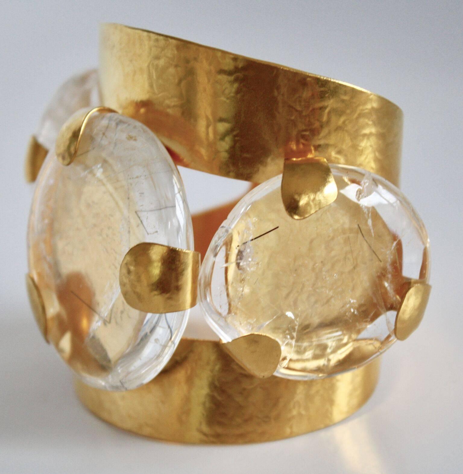 Malleable and fabulous gilded brass cuff with three exquisite rock crystals from Herve van der Straeten. 

Metal is soft, can fit any size wrist. Largest rock crystal is 2.75