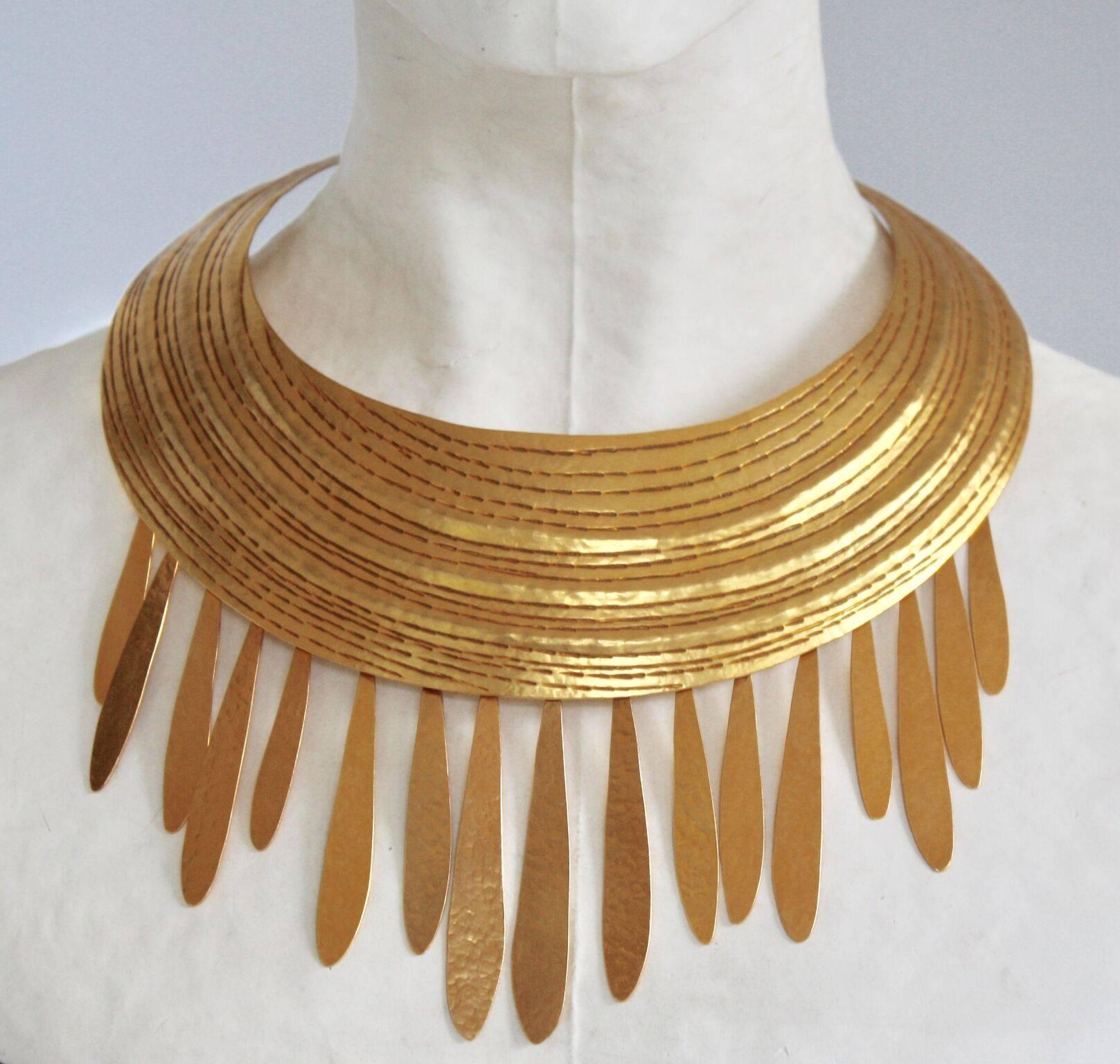 A gorgeous hand hammered gilded brass torque necklace from Herve van der Straeten with fringe detailing. 

Outside diameter - 7