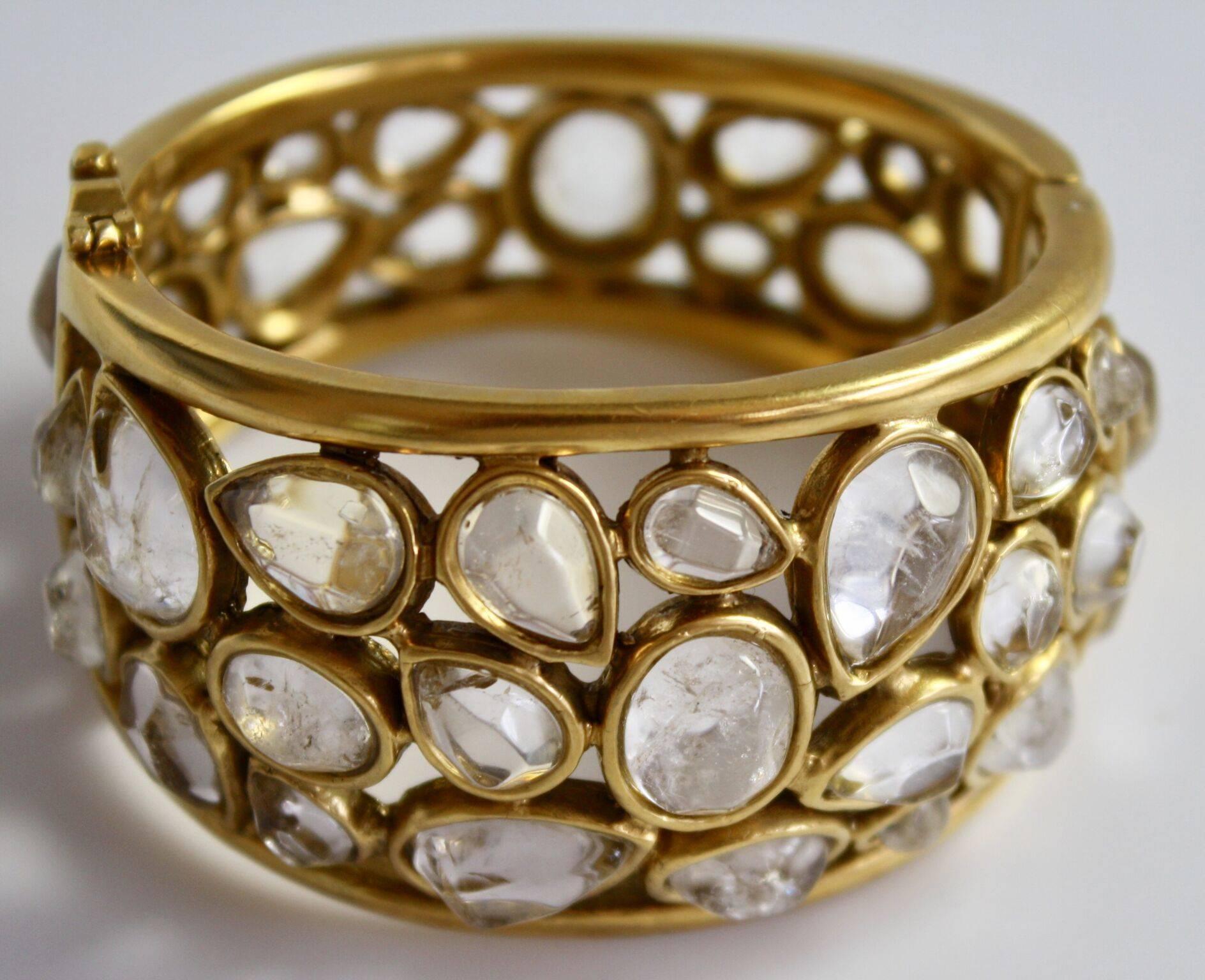 Rock crystal and gilded brass statement bracelet from Goossens Paris. 

7