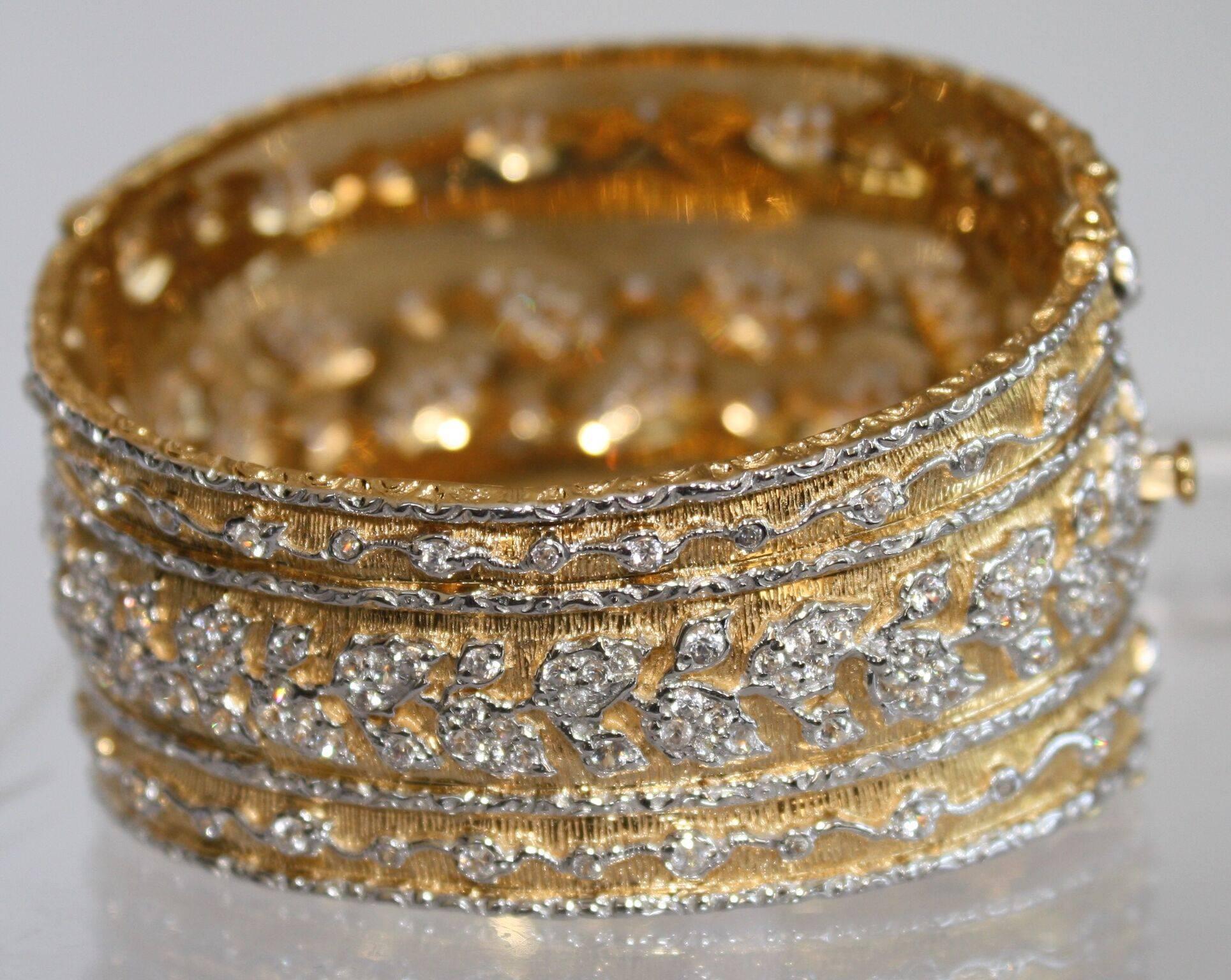 A gorgeous yellow gold and sterling silver plate cuff bracelet with CZ filigree pattern. 

6.5