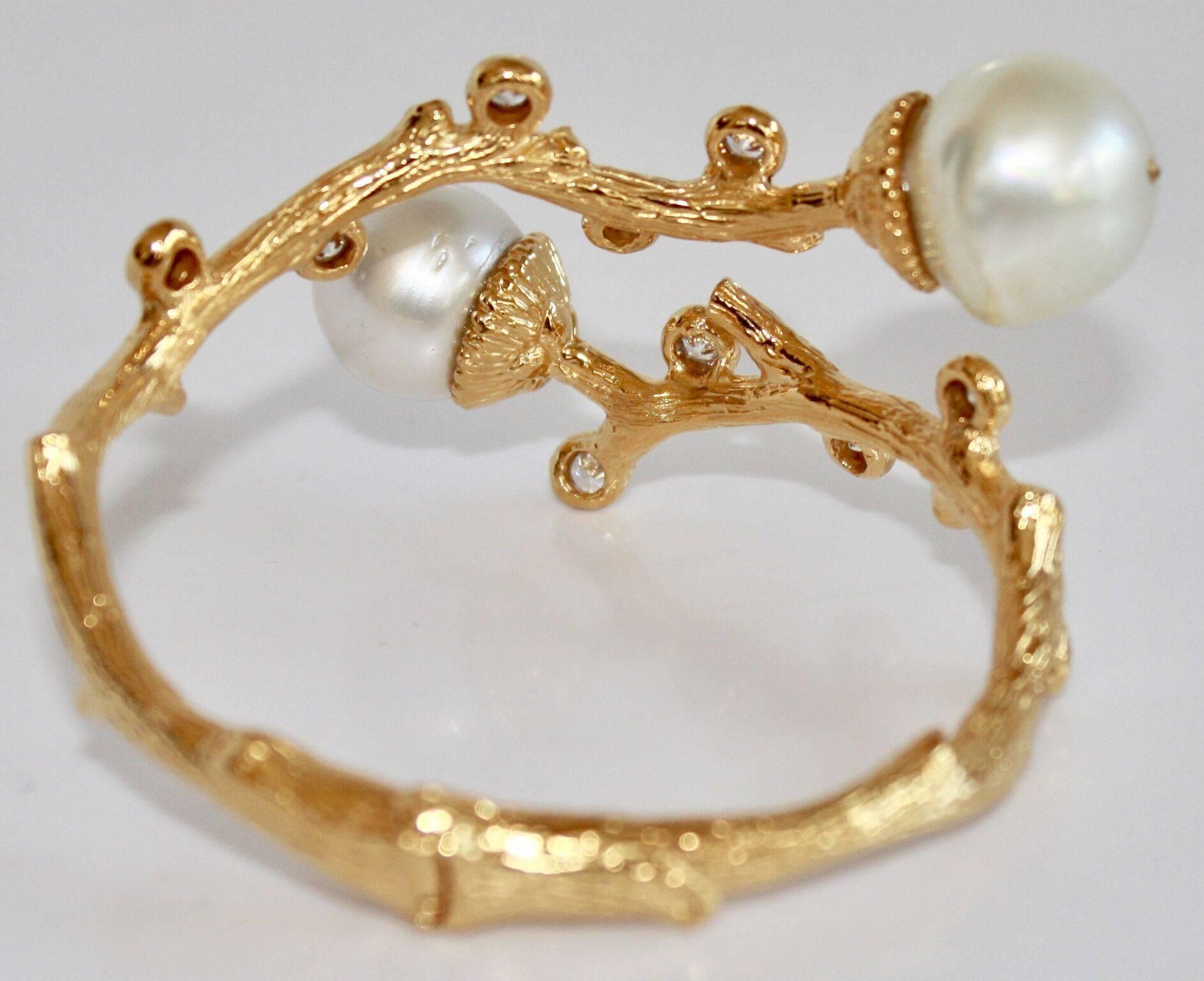 Gold plated bronze bracelet with cubic zirconia and south sea pearls. Bracelet has a discreet hinge at the back, making it easy to open and close. 

6