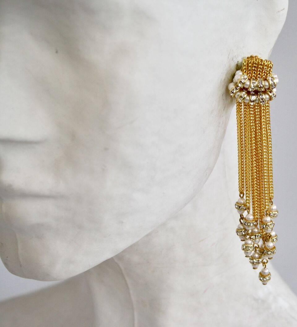 Phenomenal gold chain tassel clip earrings with glass pearls and Swarovski crystals from Francoise Montague. 

3.75